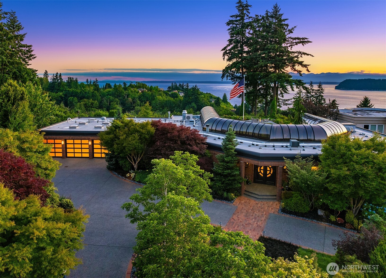 An architectural wonder! This unparalleled estate is designed for a lifestyle of comfort & grandeur. Gated masterpiece with glass walls & soaring domed glass ceilings for panoramic views of Puget Sound & Olympic Mtns. Revel in the details: NW glass art, NanaWall, hardwood flrs, honed marble. Professional style kitchen features 6 Burner Wolf range, + 3 add'l Wolf wall ovens, Sub-Zero refrigs. Main flr primary suite has 2 W-I-C's, French doors opening to deck & views, spa inspired bathroom w/one-touch Clear to Privacy Glass. Lower level Ensuite has private entrance. Huge patio & deck w/outdoor kitchen, manicured gardens, 2 outdoor fireplaces, in-ground swim spa. 6-car garage, Theatre w/wetbar, & temp-controlled wine room. A rare opportunity!