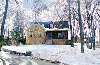 Rustic retreat in the heart of Columbia! Charming rustic retreat featuring natural stone exterior paired with western cedar accents. Nestled among mature trees on an expansive lot, the home has a timeless, lodge-inspired feel that blends seamlessly with its wooded setting. Offering 3 bedrooms, 3 1/2 baths, basement mother-in-law or teen suite, Amish hand-cut oak flooring, remodeled kitchen and bathrooms, new hvac units, new windows. Outside you'll find a 20x25 shop, puttering shed, 3 driveways, fenced backyard, 3 water features, trex decking, grilling/kitchen area, hand-picked stone walkways. Located only 1/2 mile from Maury Regional Hospital, shopping, dining and under a mile to the nearest golf course the location is perfectly situated with easy access to amenities. Do not miss your opportunity to see this custom home