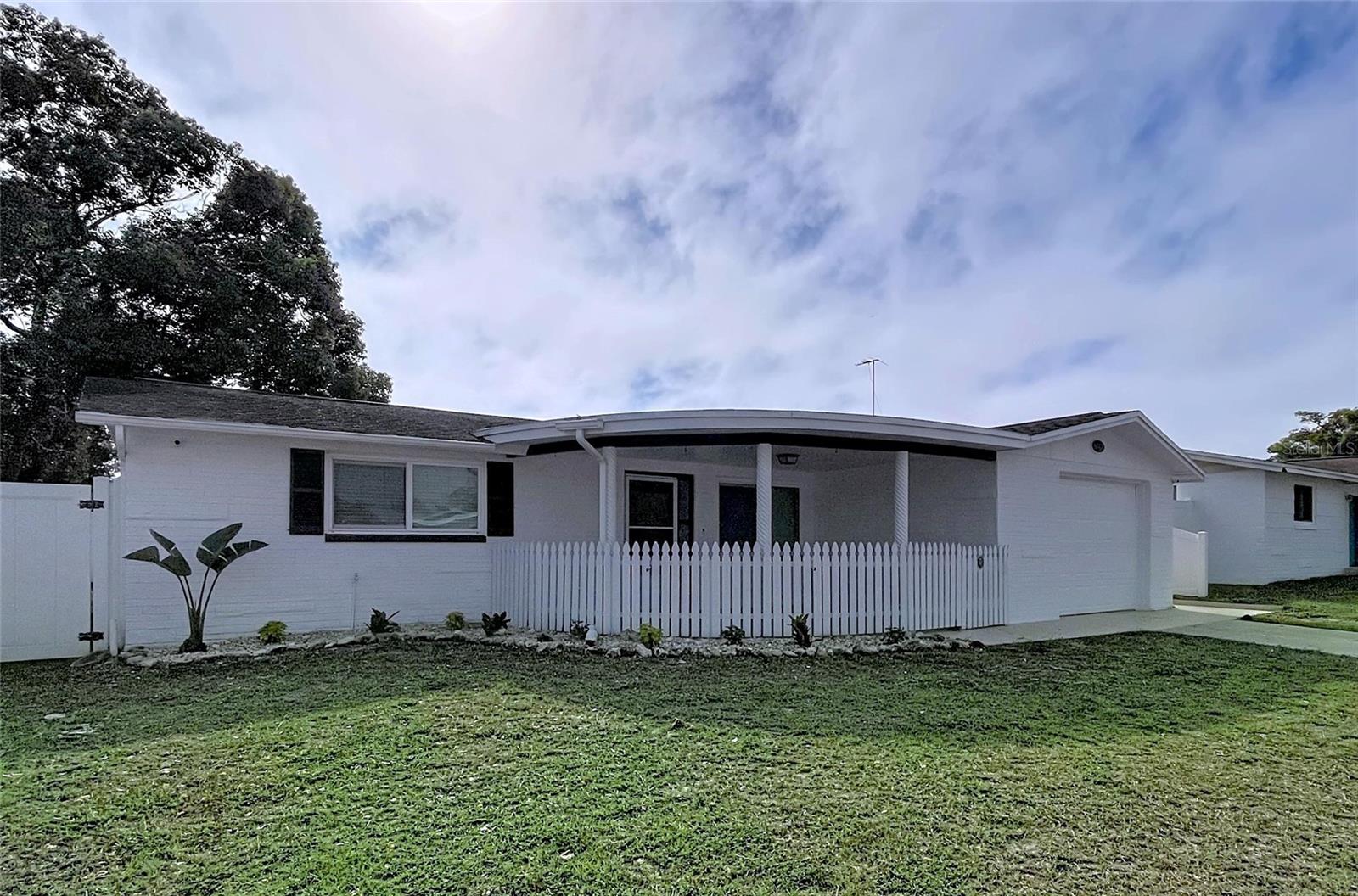 This move-in ready home features 2 bedrooms with the potential to make the home 3 bedroom, plus 2 full bathrooms. The layout flows nicely and gives an open feel with plenty of natural light and recessed can lighting adding to the bright, modern feel. Enjoy a large, bright kitchen featuring new cabinetry, perfect for everyday living or hosting friends and family. You will love the new floors and the smooth ceilings - no popcorn ceilings in this home! Outback, enjoy the fenced in yard. Ideal for pets, gardening, or just relaxing. Whether you are grilling, entertaining, or just enjoying some quiet time, this outdoor space is easy to enjoy.  Out front, you're welcomed by a cute front porch with a charming picket fence and gated entry adding great curb appeal and a cozy spot to relax. Close to the downtown area where you will find dining and shops as well as riverside Sims Park that includes a playground, splash pad area, amphitheater, and a boat launch. NO HOA and NOT in a flood zone.