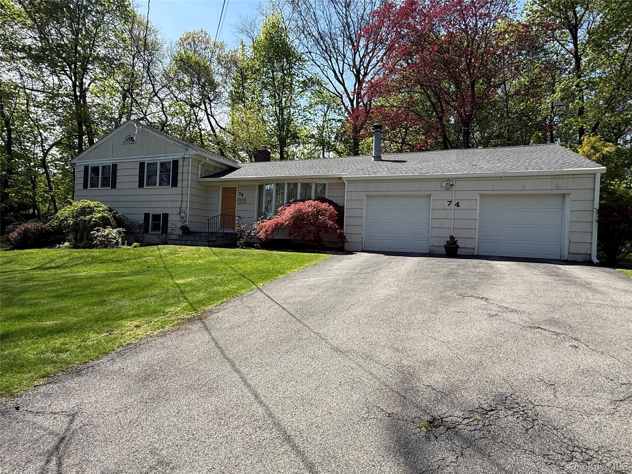 Nestled in a quiet neighborhood near a local park, this wonderful split-level home in the highly sought-after village of Briarcliff Manor offers the perfect blend of comfort, style, and community living.  Step inside to discover an updated eat-in kitchen featuring granite countertops and built-in seating—ideal for both everyday living and casual entertaining. The open-concept living and dining area is enhanced by gleaming hardwood floors and a stunning stone fireplace, creating a warm and inviting atmosphere. The primary bedroom includes his-and-hers closets and a private en-suite bath with premium Kohler fixtures. Two additional bedrooms and a beautifully updated hall bathroom with a soaking tub complete the upper level. The walk-out lower level offers exceptional versatility, boasting a large family room with a granite wet bar, a dedicated home office, and a utility room.  Key updates include new Andersen Windows, recessed lighting, and a brand new roof!  Enjoy exceptional outdoor space with an enclosed porch, a spacious patio, and a fenced-in level backyard—perfect for entertaining, relaxing, or play. Two side yards provide even more room for outdoor activities. As a resident of Briarcliff Manor, you’ll have access to outstanding amenities, including an outdoor pool, youth and senior programs, recreational activities, and year-round community events—offering a vibrant and welcoming lifestyle. There are no audio recording devices inside this property.