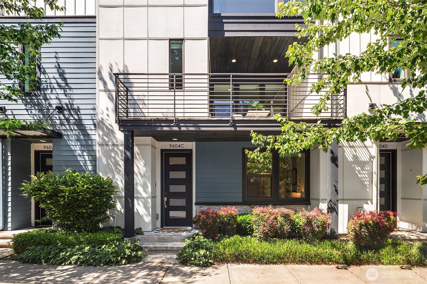 Welcome home to Dawson Square—where timeless design meets modern convenience in the heart of Downtown Bothell. This beautifully crafted, sun-filled, south-facing townhome features soaring ceilings, hardwood floors, and an open-concept main floor with a spacious kitchen, dining area, cozy gas fireplace, and private deck. Upstairs, the vaulted primary suite offers a spa-inspired oversized shower and generous walk-in closet, with two additional bedrooms and a full bath nearby. A lower-level guest suite with its own ensuite bath is ideal for visitors or a quiet home office. Enjoy upgraded finishes, a two-car garage, and thoughtful details throughout—just moments from parks, shops, dining, and trails in the top-rated Northshore School District.
