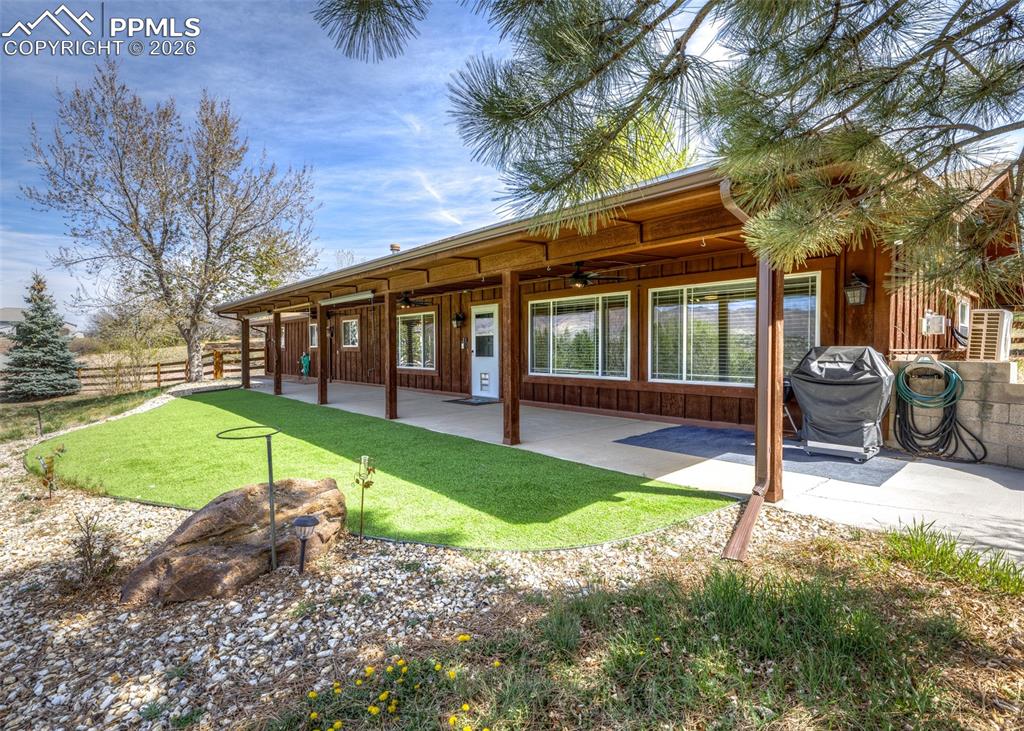 Absolutely perfect totally renovated one level rancher on one acre with unobstructed Pikes Peak & mountain range views ~ 1763 sq ft with 2 bedrooms, office, 2 1/2 baths & 2 1/2 attached garage with extra 14x11 work room with 3 walls of cabinets, plus 20x20 steel outbuilding with 1 car overhead door ~ Open concept quartz island kitchen with grey painted cabinets with soft close drawers & pull outs ~ Stainless steel appliances, pantry, pendant lighting & stone back splash ~ All remodeling done 5 1/2 years ago with new LVP flooring in living areas, new carpeting in bedrooms & office which has a full wall of built-ins ~ Totally new baths with granite counters & vessel sinks ~ Fresh interior paint ~ new stone faced gas log fireplace ~ New lighting, electric & electric panel ~ 2 mini split a/c's, security system with 6 cameras ~ laundry with sink & toilet in finished 12x11 utility room entered from garage (not figured into sq ft) ~ New vinyl windows including large picture windows looking right at Pikes Peak ~ 50x10 covered front porch ~Huge fenced yard ~ Hot water heat ~ 2x6 exterior construction ~ feels private & rural but only 2 minutes to university village in a subdivision most people don't know is there. No covenants or HOA. Shows great.