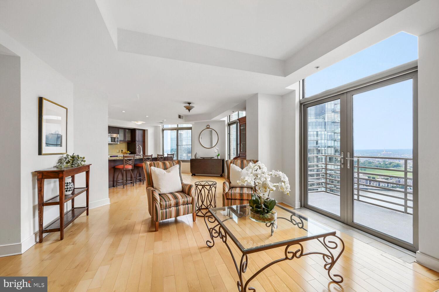 Set high on the 27th floor of The Vue in Harbor East, this spectacular two-bedroom, one-and-a-half-bath residence delivers breathtaking panoramic views of the harbor, water, and Baltimore skyline. Floor-to-ceiling windows flood the open-concept living space with natural light, seamlessly connecting to a private balcony perfect for taking in the vistas. The chef’s kitchen is both stylish and functional, featuring a center island, sleek glass backsplash, and modern finishes ideal for everyday living and entertaining. The sun-filled primary suite offers expansive windows, dual closets, and a spa-inspired bath with double vanity and glass-enclosed shower. A versatile second bedroom with custom built-ins functions beautifully as a guest room, den, or home office. One covered garage parking space conveys.  The Vue condominium is located in Baltimore's hottest neighborhood within steps to the finest restaurants, boutique shops, Whole Foods, Starbucks, the Inner Harbor, waterfront and nightlife. **The condo Fee** includes heat, AC, hot water, water, sewer, front desk staff, package acceptance, building maintenance, onsite management. Take the elevator to the outdoor green space on the 8th floor for some fresh air or walking the dog without leaving the security of the building. Take the elevator to level 2 to the MAC gym and Harbor East Cinemas. Conveniently located to I-83.
