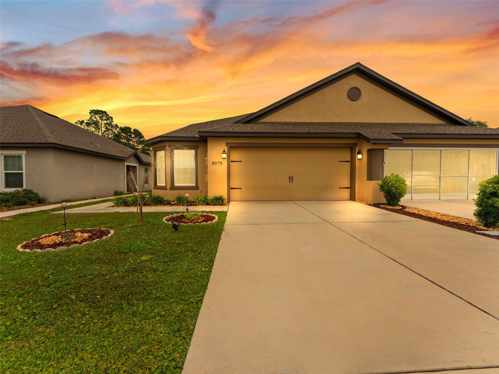 Experience modern luxury in this meticulously maintained 3-bedroom, 2-bathroom home built in 2021. Nestled on a premium lot in the gated Spring Ridge Community, this residence offers a seamless open-concept floor plan perfect for entertaining. The gourmet kitchen boasts rich wood cabinetry and energy-efficient appliances, flowing effortlessly into a spacious living area. Step outside to your private, vinyl-fenced backyard with NO REAR NEIGHBORS, providing a tranquil sanctuary overlooking the lush golf course. Enjoy resort-style living with access to a Jr. Olympic pool, 1,500 sq. ft. fitness center, clubhouse, and more. USDA FINANCING ELIGIBLE for qualified buyers. Why wait for new construction? Your Florida dream home is move-in ready today!