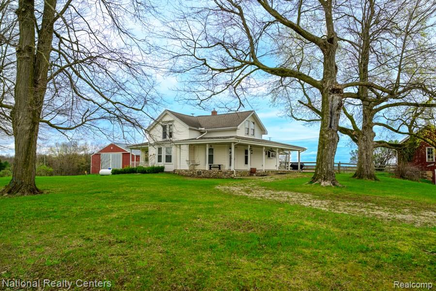 Nestled on 15.48 acres, this stunning farmhouse offers the perfect blend of rustic charm and modern comfort. Ideal for horse lovers or those seeking a peaceful country lifestyle, the property features four barns with classic beautiful original stone half walls along with a separate spacious pole barn with a concrete floor. The inviting farmhouse welcomes you with a gorgeous wraparound front porch, complete with a wood deck, stone skirting, and tongue-and-groove ceilings accented by ceiling fans and drop lighting—perfect for relaxing and taking in the serene surroundings. Out back, enjoy a covered patio for additional outdoor living. Inside, you’ll find a thoughtfully designed layout featuring a main-floor bedroom with its own private covered deck, a large primary suite with rustic flair and its own split-unit A/C, and the convenience of first-floor laundry. A four-season room Off the back offers a bright and airy retreat with tongue-and-groove ceilings and an abundance of windows. The recently updated kitchen with an island boasts granite countertops, flowing seamlessly into the dining and living areas with beautiful wood flooring throughout. Two bathrooms with some updates add modern comfort to this charminghome.Previously used for grass-fed beef and as an equestrian estate, this versatile property is ready for your vision—whether farming, horses, or simply enjoying the quiet countryside. Located just down the road from over 450 acres of state land, the peace and serenity here are truly unmatched.Whichever path you choose, this exceptional property will not disappoint. Fiber Internet. Celluar Booster - 2020. Water Heater - 2022. RainSoft Iron Whole House Water Filer - 2026. Insulated Laundry for sound. Whole house electric redone - 2020. Septice field and tank - 2018. Updates to main bath 2021. Updates to primary bath - 2026. See Features & Update sheet for more information.