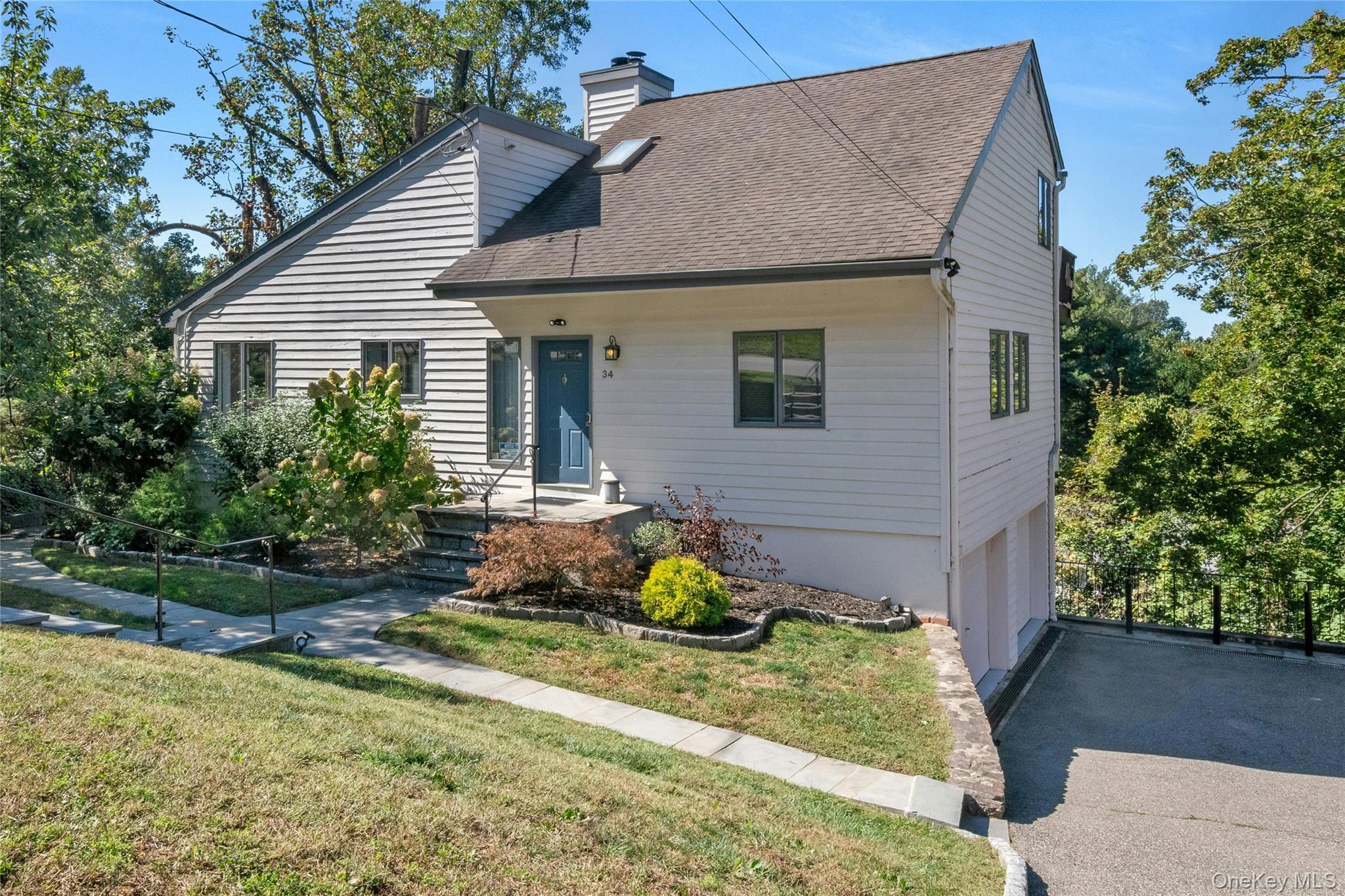 34 Piping Rock is a stunning contemporary home that offers the perfect blend of style, functionality and comfort. Featuring 2 bedrooms but lives like 3 or more with stunning seasonal views of the Hudson River as well as a flexible floor plan ideal for a home office, den or guest space.  The lower level which is completing above ground with its own private access and full bath offers endless possibilities. Truly "Move-In Ready", meticulously maintained with many recent upgrades to the roof, boiler, water heater and central AC mechanicals. Enjoy an open-concept living area, abundance of natural light and seamless indoor-outdoor flow- perfect for both everyday living and entertaining. The modern kitchen boasts stainless steel high-end appliances and quartz counters.  A must-see property offering versatility, modern elegance and effortless living - this is contemporary living at its finest!