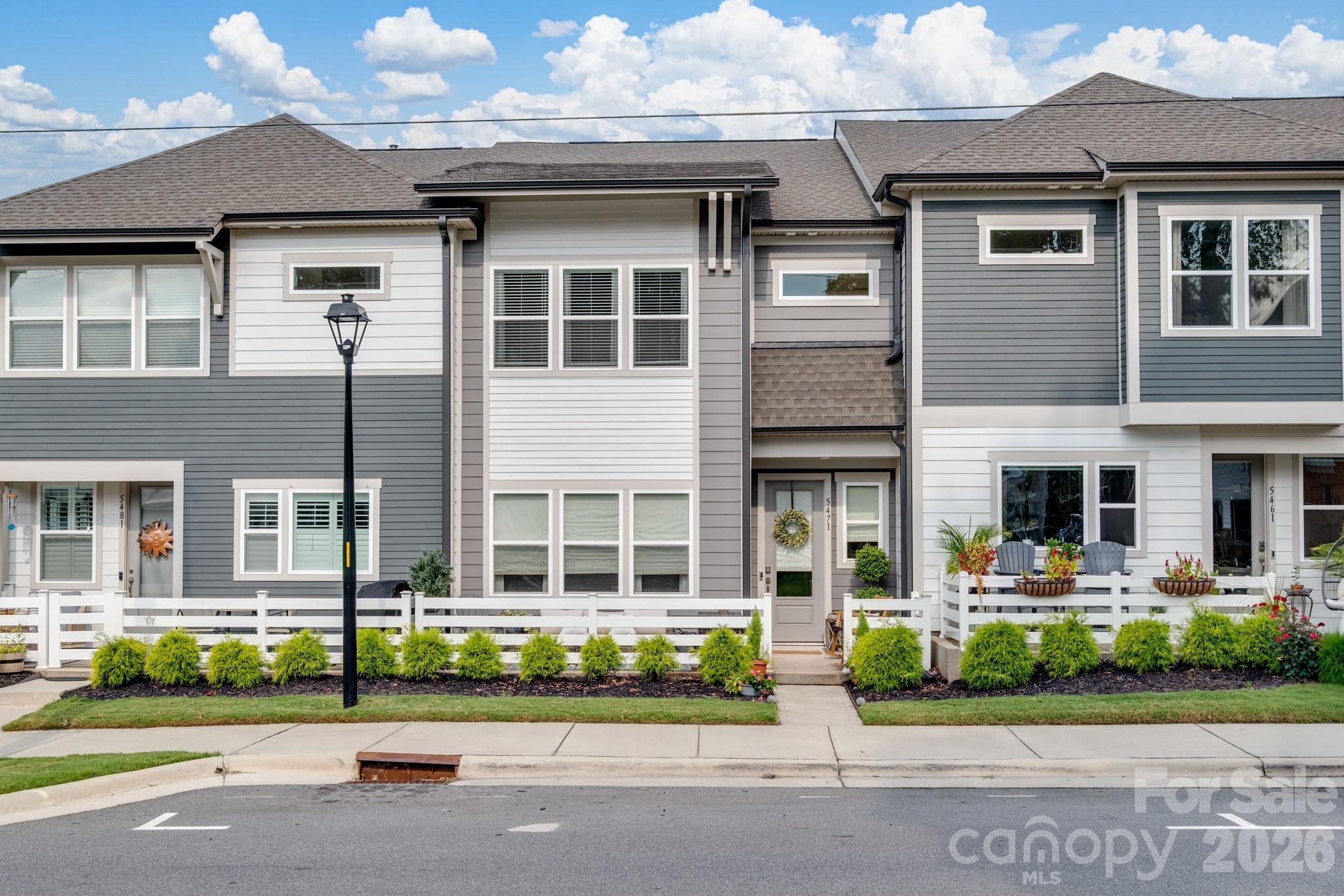 Welcome to easy downtown living in Pennant Square! This beautifully appointed townhouse located in the heart of downtown Kannapolis offers the perfect blend of modern comfort, convenience and location. Walk to this popular area for shopping, dining, breweries, entertainment and baseball games! Step inside to an inviting, thoughtfully designed interior. This better than new home has lots of upgrades and also includes a two car garage with epoxy floor PLUS convenient parallel parking for the convenience of your guests. The front patio is perfect for relaxing with coffee or talking to neighborhood friends. This floorplan has three bedrooms in a split bedroom design plus a loft area for entertainment or a home office.  The beautiful Primary suite has an oversized shower and huge closet!  Secondary bedrooms share a luxury bath and laundry is upstairs and includes additional storage.  The attic offers even more space. This is an amazing opportunity to make downtown Kannapolis your home!