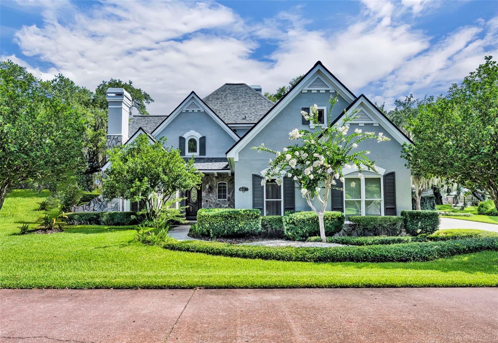 One or more photo(s) has been virtually staged. Tucked away in the SERENE AND SOUGHT AFTER of Harbour Oaks Pointe (only 16 homes), this stylish 3 bedroom, 2.5 bath home offers over 2,726 square feet of elegant living space—and a CANAL FRONT LOCATION that’s a dream for water lovers. From the moment you arrive, you'll appreciate the thoughtful layout and timeless design. The FIRST FLOOR PRIMARY SUITE is a true retreat, offering a spa-inspired bath with a soaking tub, a spacious walk-in shower, and a large custom walk-in closet. There’s even room to create a private seating area within the suite—perfect for morning coffee or evening relaxation. The kitchen is exceptionally large, stylish and functional…a chef’s dream! Be sure to take note of the newer appliances, a cooking island, an independent wine refrigerator, and a pantry with pull-out shelving, A charming breakfast nook offers peaceful views of the pool area, while the formal dining room seamlessly blends into a stylish living room anchored by a cozy fireplace. Just beyond, the spacious family room boasts an additional fireplace with vaulted ceilings and the sliding doors create an entry into your BACKYARD OASIS. Upstairs, a versatile loft landing provides the perfect space for a media lounge or open-concept office. The expansive second bedroom is currently used as an office and workout area, but could easily serve as a second primary bedroom. It shares a Jack-and-Jill style bath with the third bedroom, offering comfort and flexibility for family or guests. DISCOVER THE OUTSIDE! The covered patio is ideal for lounging and entertaining by the 40’ LAP POOL.  The backyard is dotted with fruit trees—avocado, lemon, lime, loquat, and banana—adding both charm and bounty to your everyday life. Just a few steps away you are at WATERS EDGE ready to launch your water toys…kayaks, boat, jet skis or paddle boards, and explore Lake Gatlin or Little Lake Conway. Throughout the home, you’ll find abundant closet space, a walk-in attic with plank flooring for storage, and an inside laundry room equipped with built-in cabinets and a pull-down ironing board. The side-entry two-car garage includes built-in cabinetry, and both washer and dryer are included with the home. Don’t forget to take note of the many custom appointments…solid oak flooring, plantation shutters, extensive crown moulding, and  tray, gable and gazebo ceilings  Ideally located just minutes from Downtown Orlando, you’ll have easy access to a wide array of restaurants and entertainment. And for those who love to travel, Orlando International Airport is just a short drive away. Escape to peace and serenity, schedule your private showing today!