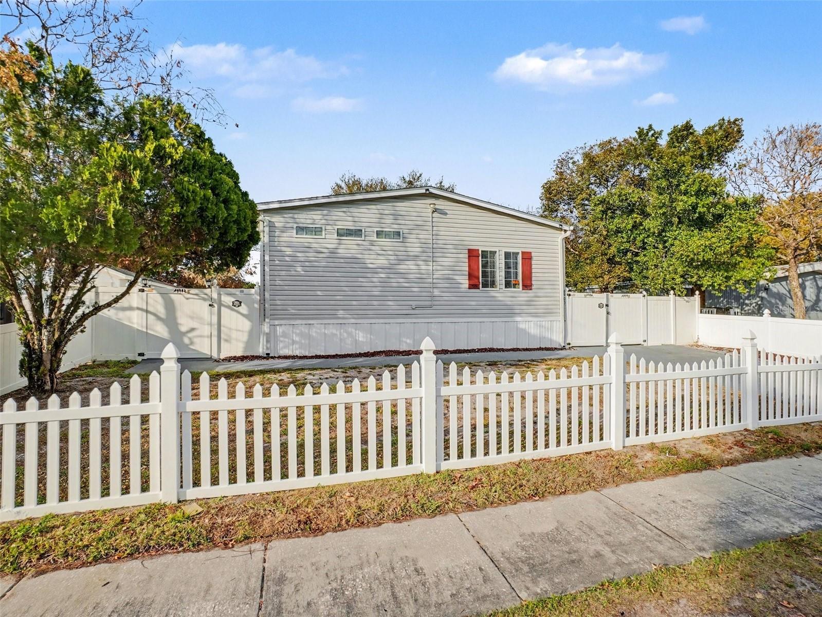 One or more photo(s) has been virtually staged. Beautifully renovated and completely turnkey! This stunning home showcases fresh neutral paint and brand-new flooring throughout, offering the blank slate you have been searching for and so much more. The open-concept floorplan is perfect for both everyday living and effortless entertaining, offering seamless flow between the living and dining spaces. At the heart of the home, the spacious kitchen impresses with a large center island featuring a breakfast bar, ample counter space, and abundant storage—ideal for gathering with family and friends. Step outside to enjoy the expansive paver patio with a covered dining area—perfect for outdoor entertaining year-round. The private primary suite is a true retreat, complete with a luxurious en-suite bathroom and dual walk-in closets for exceptional comfort and convenience. A versatile bonus area provides flexible space for a home office, playroom, or media room to fit your lifestyle needs. Ideally located near Orlando International Airport, this home offers both comfort and convenience in a prime location. Move-in ready and designed to impress, this is one you won’t want to miss!