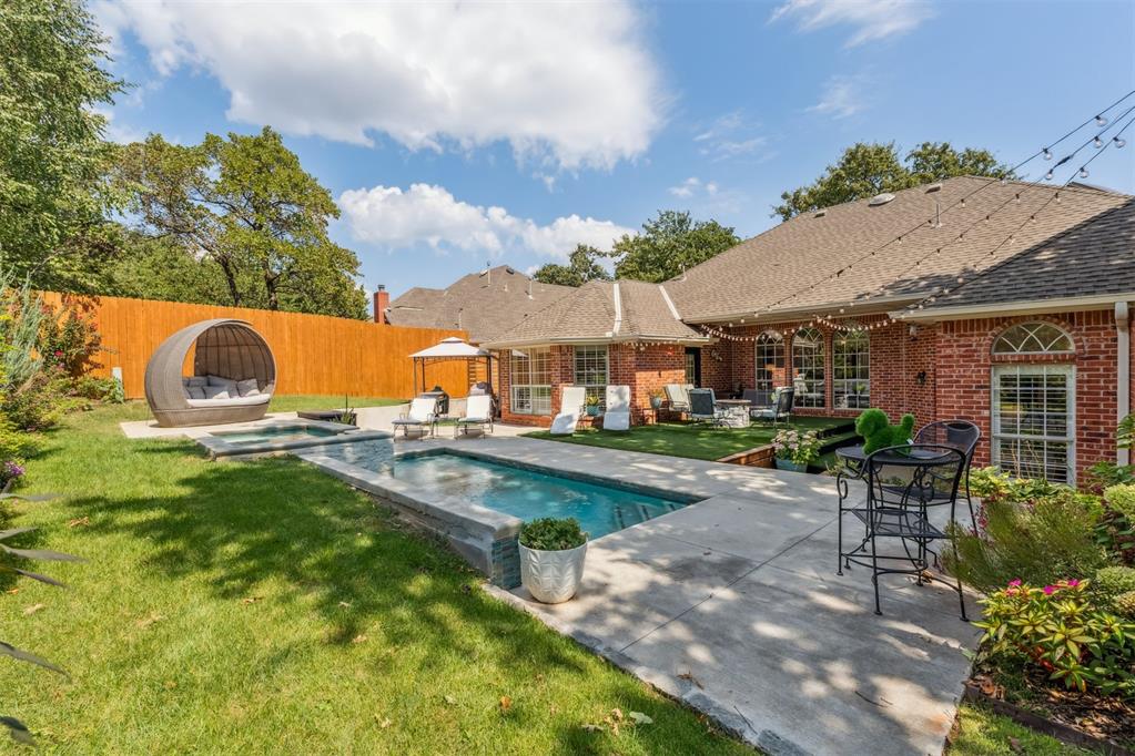 Welcome to this exquisite home in the Bradbury Corner community, nestled among mature trees this home offers an ideal floor plan for entertaining w/a large open kitchen & sep living area, creating the perfect gathering spaces for family/friends. The kitchen has butcher block counters, shiplap island, skylight, built-in bench seating, desk, & a gas cooktop. Plantation shutters, crown molding, and rich wood floors—that elevate the home from floor to ceiling. Spacious primary suite is a serene retreat w/a wall of windows w/plantation shutters that allow for abundant natural light. Primary bath has been completely remodeled into a spa-like oasis featuring a soaker tub, marble look stone tile, custom-built cabinetry, quartz counters, and updated lighting. Secondary bedrooms are also generously sized w/raised ceilings & walk in closets. Secondary bath has been beautifully updated w/herringbone subway tile in the shower & floors, quartz counters, & custom cabinetry. Add'l full bath w/a classic tub-shower combo sits adjacent to an add'l bedroom/office, offering flexibility. The study features sophisticated wainscoting & crown molding, adding warmth & character. The updates continue throughout the home with modern lighting & a charming laundry rm enhanced w/trendy tile, wallpaper accents, & a convenient mud-bench conversion. Step outside into your private backyard paradise where you’ll find an absolutely gorgeous heated saltwater pool & hot tub, lush landscaping & patio lighting for evenings outdoors. A play area, multiple patio spaces, & an 8ft privacy fence create the perfect setting for gatherings, sports, or peaceful relaxation. Storm shelter in garage & an outdoor storage shed, combining comfort w/practicality. Excellent access to I-35 w/an easy commute to Downtown OKC, Tinker AFB, & Will Rogers Airport, while enjoying all the conveniences of Edmond living, shopping, & dining. Stylishly updated, this Bradbury Corner home is truly one of a kind!