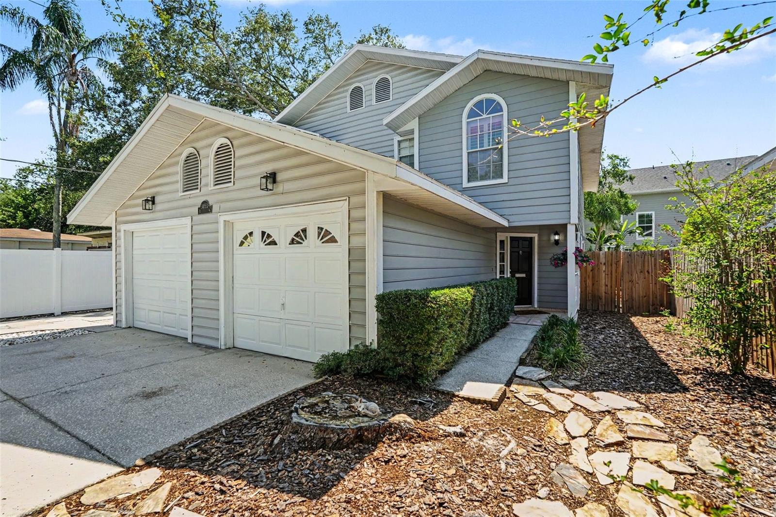 Your South Tampa oasis awaits in the heart of Palma Ceia, just five blocks from iconic Bayshore Boulevard. This beautifully maintained 2 bedroom, 3 bath townhome with a 1 car garage offers an incredible blend of charm, privacy, and everyday convenience, with no HOA, no CDD, and not located in a flood zone.From the inviting front porch, step inside to a private foyer featuring wood-look LVP flooring, custom baseboards, and plantation shutters that continue throughout the home. The updated kitchen is both stylish and functional, offering granite countertops, a subway tile backsplash, updated appliances, and a convenient pass-through to the spacious living and dining area, perfect for entertaining or keeping the conversation flowing.The main living space feels warm and welcoming, anchored by a beautiful built-in fireplace and flanked by two sets of French doors that open to a large screened porch and private fenced backyard. Shaded by mature trees, this outdoor retreat feels like a hidden escape in the city, ideal for morning coffee, evening wine, weekend grilling, or relaxing after a day on Bayshore.Upstairs, you’ll find two generous bedroom suites, each with its own full bathroom. The spacious primary suite features double-door entry, custom crown molding, a large walk-in closet, and double windows with beautiful sunset views. The en-suite bath includes a dual-sink vanity with granite countertop, crown molding, and a custom glass shower door. The secondary suite offers plenty of space, a vaulted ceiling, great morning light from the east-facing window, a roomy closet, and an updated bath with granite countertop and a tub/shower combo with custom shower door.Additional features include a new HVAC system installed in December 2024, fresh interior and exterior paint, a fully fenced backyard, 3M window film on east and west-facing windows and French doors, washer and dryer hookups in the clean single-car garage, and thoughtful updates throughout. Lovingly cared for and move-in ready, this Palma Ceia townhome places you just around the corner from boutiques, restaurants, shops, and the best of the South Tampa lifestyle.