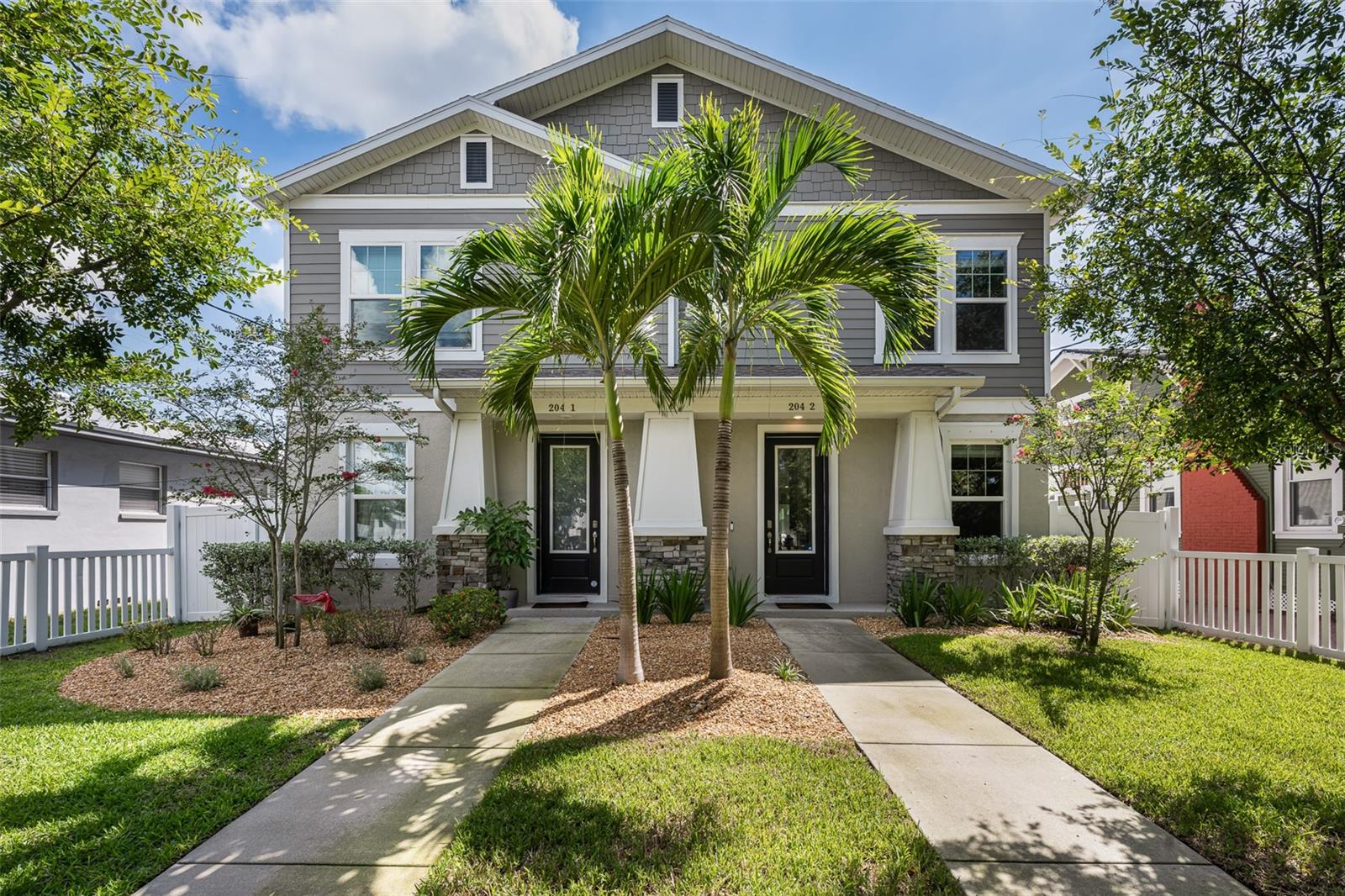 Virtually Staged. Completed in 2019, this two-story townhome offers four bedrooms, three-and-a-half baths, approximately 2,610 heated square feet, and the added benefit of no HOA.The kitchen is designed for both everyday living and entertaining, with natural gas cooking, a Whirlpool gas cooktop, wall oven and microwave, Bosch dishwasher, and reverse-osmosis filtration at the kitchen sink.A distinctive feature of the home is the private bedroom retreat located above the garage and accessed by its own interior stairwell. Thoughtfully separated from the primary living areas while remaining fully integrated into the home, the space offers flexibility for a guest suite, home office, or additional living area. A dedicated Mitsubishi mini-split system provides independent climate control.The main residence is served by a zoned Lennox heat pump system with Wi-Fi thermostat, electronic air cleaner, and UV coil light. Additional systems include whole-home salt-free water conditioning and filtration, a tankless Rheem water heater, natural gas service, and maintained Sentricon termite monitoring stations.Outside, a covered front entry faces South Albany Avenue beyond a fenced front yard, while a synthetic deck extends along the side of the residence just off the covered and screened lanai. Rear-alley access leads to a concrete driveway and attached garage, keeping vehicle access away from the front streetscape. A Rain Bird irrigation system serves the landscaping.The washer, dryer, garage refrigerator, and Google front-door camera convey with the home.With recent construction, a flexible four-bedroom floor plan, thoughtfully upgraded systems, and no HOA, this residence offers a compelling combination of functionality and convenience, with easy access to Hyde Park Village, the SoHo district, Downtown Tampa, and surrounding South Tampa amenities.