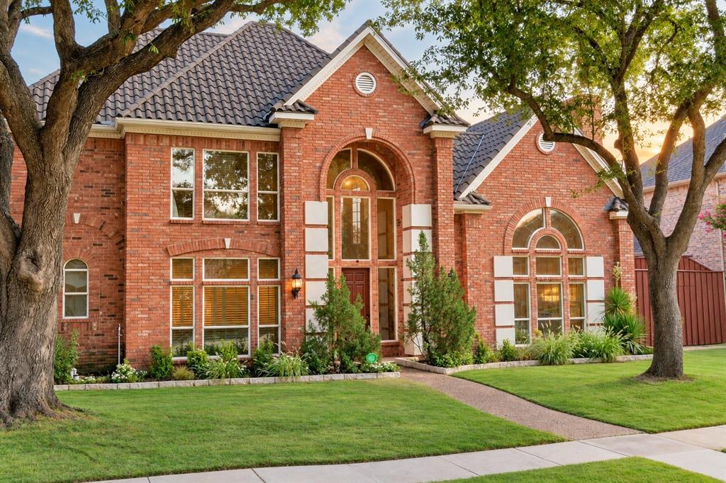 Discover an exceptional combination of location, privacy, and functionality in West Plano's desirable Deerfield neighborhood. Positioned near the edge of the community, this home offers convenient access to Deerfield's celebrated Halloween and Christmas traditions without navigating the busiest seasonal streets. Enjoy mature trees, walking paths, nearby parks and schools, shopping, restaurants, and everyday conveniences. Just minutes from Legacy West, The Shops at Legacy, Grandscape, and major corporate headquarters, with easy access to Dallas North Tollway, SH121, and US 75. Both DFW International and Dallas Love Field airports are approximately a 30-minute drive.Inside, a distinctive C-shaped architectural design connects expansive living spaces with views of the private pool courtyard. The functional five-bedroom floor plan features TWO BEDROOMS ON THE MAIN LEVEL: a spacious primary suite with direct pool access and a separate guest or in-law suite. Three additional bedrooms upstairs provide flexibility, along with an oversized game-media room equipped with a premium Polk Audio surround sound system. A dedicated study with French doors offers a separate workspace. The generous kitchen features granite countertops, abundant cabinetry, a central island, and breakfast-bar seating, opening naturally to adjoining living areas.At the heart of the home, a courtyard-style pool and spa create an inviting retreat for relaxation and entertaining. Afternoon shade at the pool. A 10 FEET TALL PRIVACY FENCE provides exceptional seclusion, complemented by mature landscaping. Dramatic two-story ceilings, a sweeping curved staircase, hardwood floors, multiple living areas, and a rear-entry three-car garage add architectural character and everyday practicality. Pet-free throughout its ownershipExperience the unique advantages of Deerfield living with a convenient West Plano location, exceptional privacy, and a versatile layout designed for living, working, and entertaining.