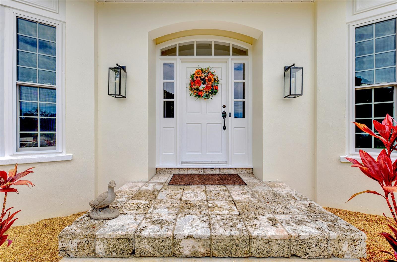 Significant Price Improvement! Experience one of the finest luxury values in Bradenton Country Club.A rare opportunity to own one of the community's most architecturally significant homes, this custom Harry MacEwen-designed residence is perfectly positioned on an exceptional homesite with breathtaking panoramic views of the lake and Bradenton Country Club golf course. Cherished by only its second owner, the home has been thoughtfully transformed with extensive improvements and renovations completed since 2015, blending timeless architecture with today's luxury lifestyle.Even better, enjoy the freedom and savings of No Flood Insurance Required, No CDD Fees, and No HOA Fees.Designed to maximize the spectacular views from nearly every room, the home features soaring volume ceilings, dramatic exposed beams, walls of windows, custom built-ins, abundant storage, rich wood flooring throughout much of the living space, and a wood-burning fireplace that creates a warm and inviting atmosphere. The thoughtfully designed floor plan offers exceptional spaces for both everyday living and effortless entertaining.The completely renovated chef's kitchen serves as the heart of the home, featuring premium appliances including dual ovens, dual dishwashers, a high-end induction cooktop, abundant custom cabinetry, and stunning views overlooking the infinity-edge pool, tranquil lake, and manicured fairways beyond.The spacious primary suite is a private retreat with a beautifully remodeled spa-inspired bathroom, while the flexible second-floor layout provides generous guest accommodations along with versatile space for a home office, media room, fitness area, or additional living quarters.Outdoor living is equally impressive. The infinity-edge pool appears to blend seamlessly into the lake beyond and is surrounded by an expansive travertine deck offering multiple areas for relaxing, dining, and entertaining. Aluminum and privacy fencing provide both security and seclusion while preserving the remarkable views.Since 2015, the current owners have invested extensively to enhance both the beauty and longevity of the home. Major improvements after ownership include a newer roof, impact-rated windows and sliding glass doors, replacement HVAC system, new siding, a completely renovated kitchen, beautifully updated bathrooms, upgraded irrigation system, fresh interior and exterior paint, a redesigned circular driveway, and numerous additional enhancements—providing exceptional peace of mind for the next owner.Homes of this caliber, with this combination of architectural pedigree, extraordinary views, extensive renovations, and outstanding value, rarely become available. Ideally located just minutes from the Gulf beaches of Anna Maria Island, downtown Bradenton, Sarasota, exceptional dining, shopping, and medical facilities, this remarkable residence offers luxury living in one of Bradenton's most desirable golf course settings.Room sizes are approximate and should be verified by the buyer.