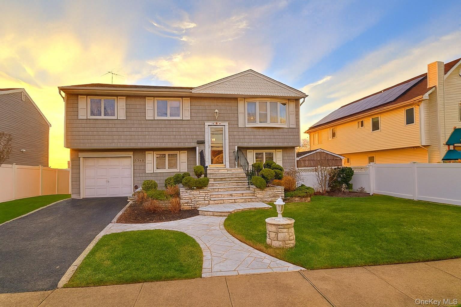 Expanded, Spacious Waterfront Hi-Ranch!Discover the perfect blend of comfort, convenience, and coastal living in this generously expanded Home situated in the desirable Ocean-Lea area. Ideal for commuters, the home offers easy access to the LIRR train station and Lawson Blvd while providing serene waterfront relaxation right in your backyard.Property Highlights:Waterfront Lifestyle: Enjoy a large L-shaped yard directly on the canal—perfect for boating, relaxing, or entertaining outdoors.Expansive Lower Level: Features a private bedroom, a cozy fireplace family room, and a large, sun-filled summer room with a wet bar—ideal for seamless indoor/outdoor gatherings.Spacious Upper Level: Includes 3 bedrooms, a large eat-in kitchen, an open dining/living room layout, and a beautifully extended 3rd family room for added comfort and flexibility.Modern Comforts: Central air conditioning and 3 separate heating zones for efficiency and year-round comfort.Quality Finishes:  hardwood and Carpet floors throughout.Parking & Storage: Private driveway and garage.Flood Insurance: $1551 AnnualThis expanded waterfront home offers extra living space, excellent flow, and a rare combination of commuter convenience and coastal charm!