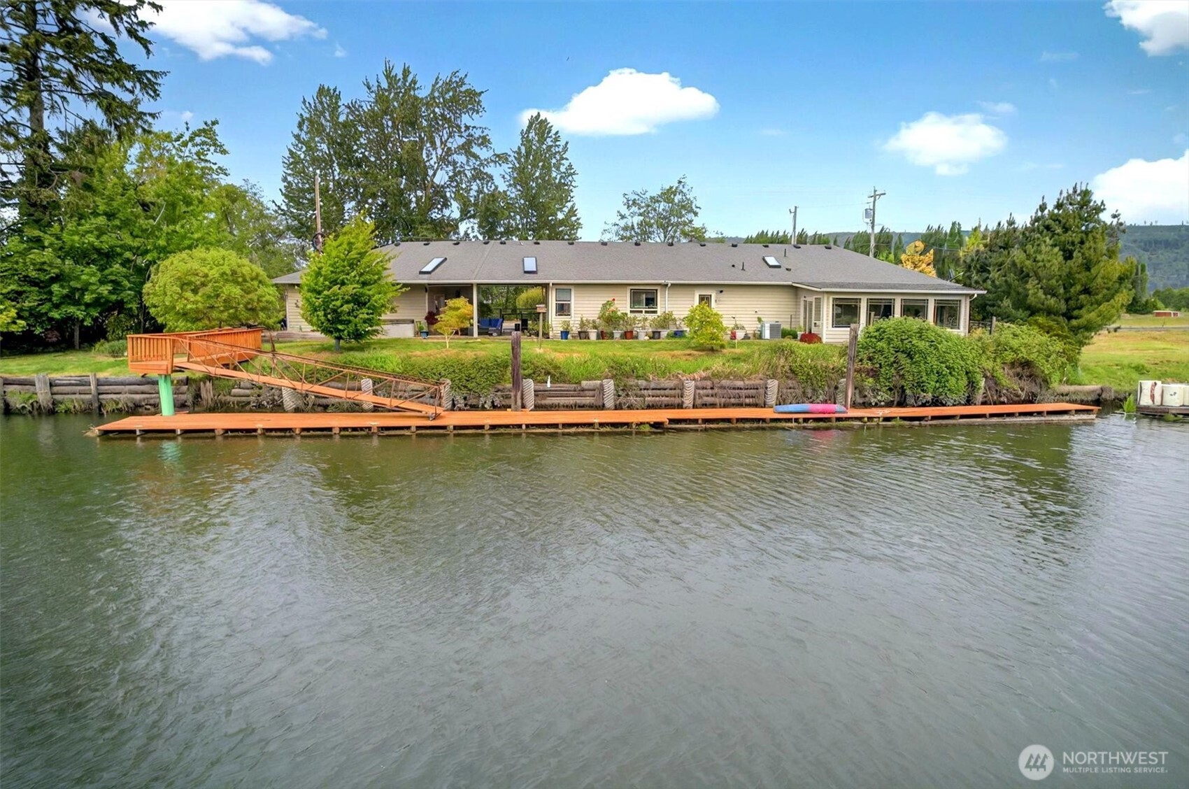 Welcome to your dream 3-bedroom, 2-bath waterfront home! Inside, you’ll find gorgeous granite countertops, shiny stainless steel appliances, and cozy knotty alder cabinets, all tied together with beautiful bronze maple floors. The big master suite is a total treat with a roomy walk-in closet and an expansive spa-like bathroom. You'll love to spend time on the covered patio with built in shades, built in propane hook-ups for a fire table and BBQ and a relaxing hot tub overlooking the water. The new 115 foot dock is a great place to moor your boat or launch you kayaks for a quick adventure. Tucked away on a quiet island in the middle of the Columbia River, it’s the perfect spot to kick back, watch birds and wildlife, and live out your dreams.