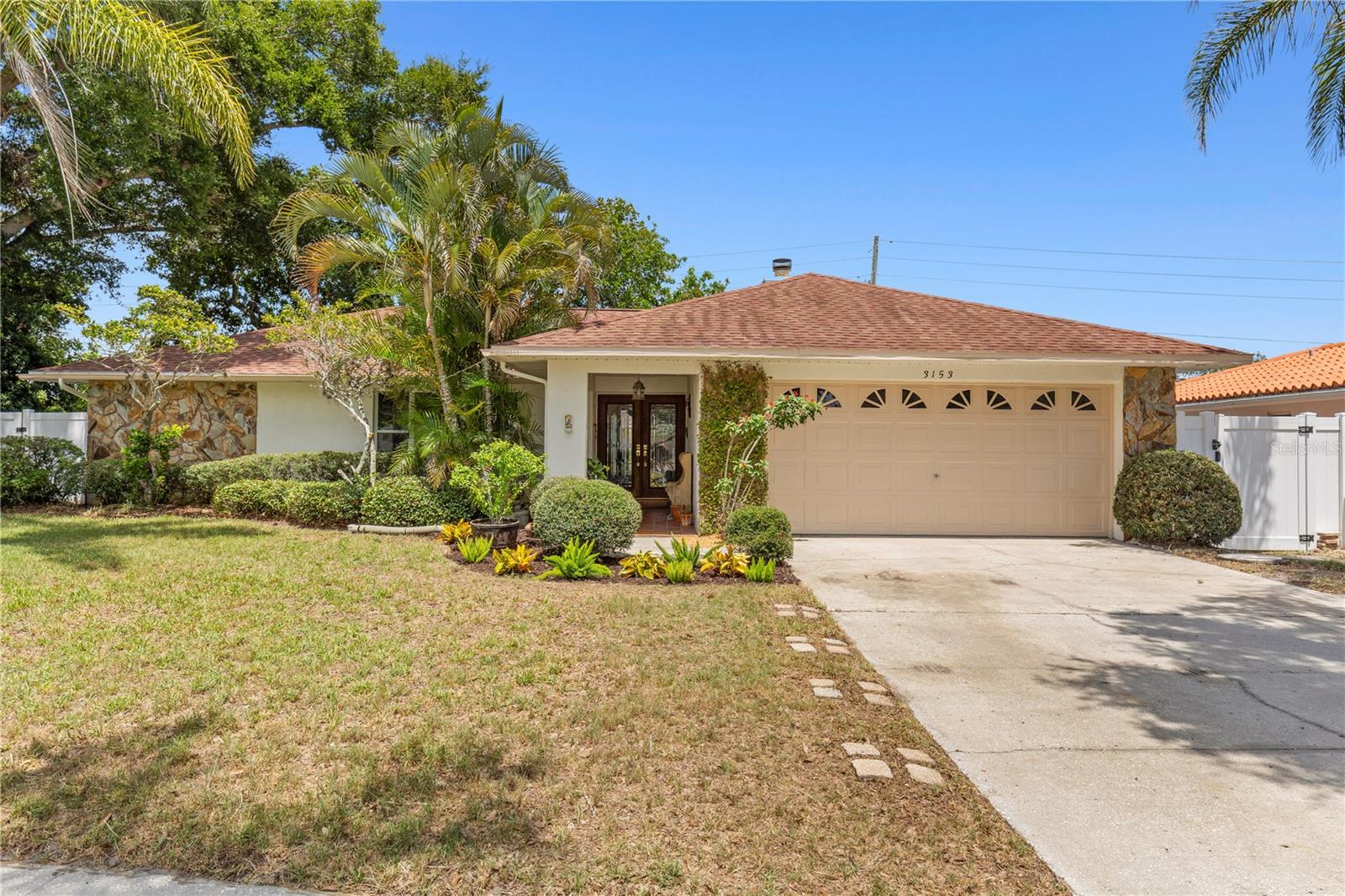 Welcome to this spacious 4-bedroom, 2-bathroom, 2-car garage home offering 2,058 square feet of living space in one of Dunedin's most desirable neighborhoods. Located on a quiet cul-de-sac with no HOA, this property sits in a high-and-dry, non-flood zone location and has never flooded. Freshly painted inside and out, the home features a desirable split-bedroom floor plan that provides both privacy and functionality. The primary bedroom has a sitting room that could be used as a nursery or an office. The versatile fourth bedroom can easily serve as a home office, den, playroom, or guest room. Enjoy the convenience of being just minutes from shopping, dining, and everyday amenities. Best of all, you're only approximately 3 miles from vibrant downtown Dunedin, known for its charming shops, restaurants, breweries, and waterfront parks. In the other direction, the Dunedin Causeway and beautiful Honeymoon Island State Park are also just 3 miles away, offering stunning Gulf beaches, nature trails, kayaking, and endless opportunities to enjoy the Florida lifestyle. Don't miss your chance to own a well-maintained home in an exceptional location that combines comfort, convenience, and the best of coastal living.