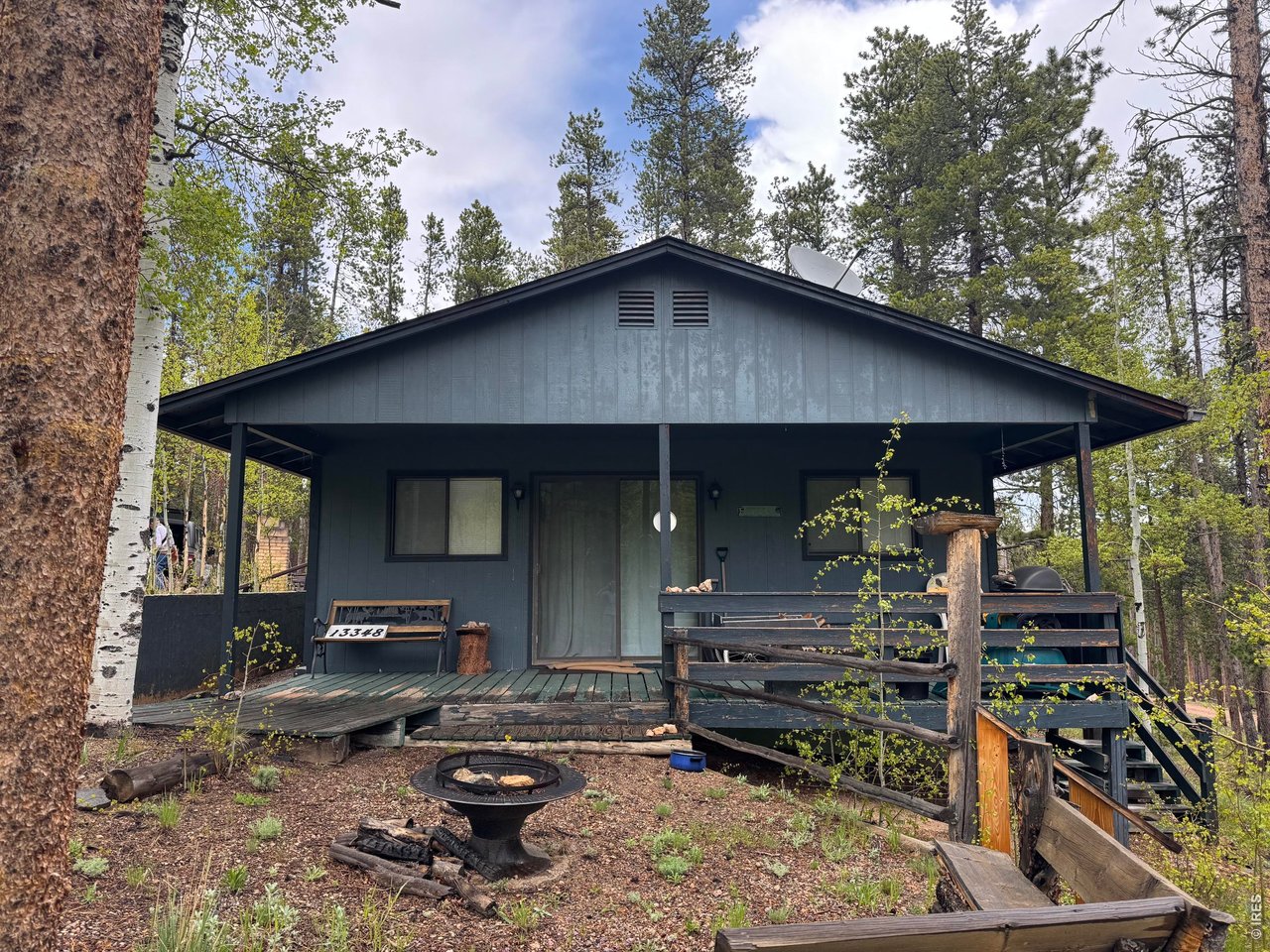 Enjoy a mountain getaway only 1 hour from Fort Collins with year round access. This Pingree Park Paradise is on 2.1-acres and is set up for your horses with a loafing shed and corral. Spacious two-bedroom, one-bath cabin is located 13 miles up Pingree Park Road. Beautiful mature trees. Amenities include phone, electric and supplemental solar forced air, a well, and a septic system. Internet is available through Hughes Net satellite, StarLink or CenturyLink. All kitchen appliances are included, plus a beautiful working antique Majestic wood cook stove. Cozy living room with wood burning stove and access to covered deck. Close to hiking, fishing, and hunting. Wildlife viewing includes elk, moose, turkey and deer! Access from Pingree Park Road or Inca Drive. Road is plowed and maintained year-round because of the CSU Camp at the end of the road. Breathe in the mountain air and relax in this beautiful mountain setting.