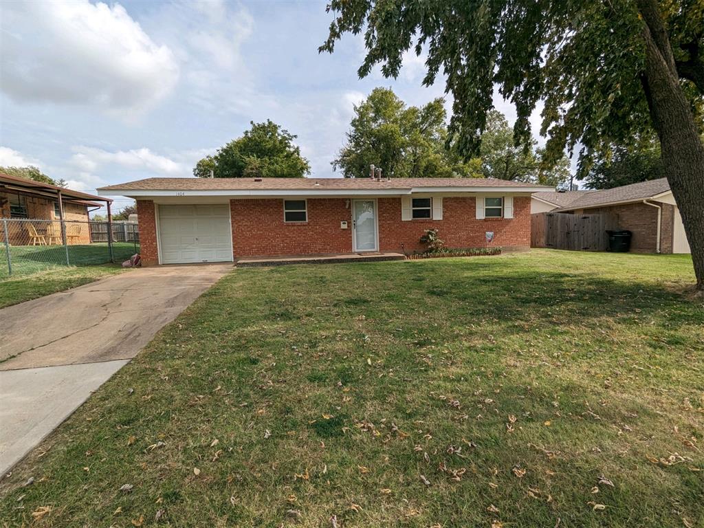 Check out this cute 3 bedroom home now available. This charming home features 3 bedrooms, an updated bathroom with new vanity and a large walk-in shower, wood laminate flooring in the living room, a gas stove, fridge, a storm shelter in the garage and a huge back yard! Conveniently located off of Telephone Rd between 4th and 19th.