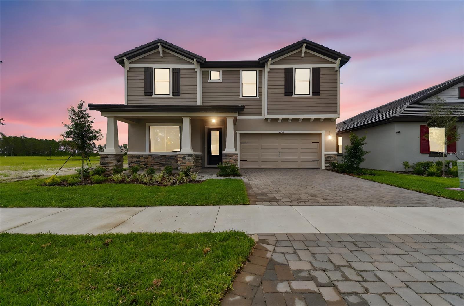 Luxury Living and location, the Juniper at Two Rivers.  Step into over 3,200 sq. ft. of thoughtful design with this 5-bedroom, 4-bathroom two-story stunner, perfectly located on a premium homesite with water views in the highly desirable Two Rivers community.  This home is loaded with upgrades from the moment you walk in—wood-look tile flooring, tall ceilings, and an open-concept layout that blends function and elegance. The gourmet kitchen features white shaker cabinetry with crown molding, under-cabinet lighting, quartz countertops, stainless steel appliances, and a massive center island—ideal for entertaining or everyday life.  Downstairs, a private guest suite with full bath and shower offers flexibility for multi-gen living. Upstairs, the spacious owner’s suite is a true retreat with double doors, a Roman-style walk-in shower, dual vanities, and oversized closet space. Secondary bedrooms are generous and well laid out, with two additional full baths and a flexible loft space perfect for play, work, or media.  Enjoy the benefits of an extended driveway, and plenty of yard space for outdoor living. Located in a lifestyle-rich, master-planned community with top-rated schools, parks, trails, and a private clubhouse, The Juniper offers the perfect blend of luxury and location.  Don’t miss this opportunity.  The Builder will contribute to closing costs with use of their preferred lender.  ALL of the amenities are under construction and not readily available.
