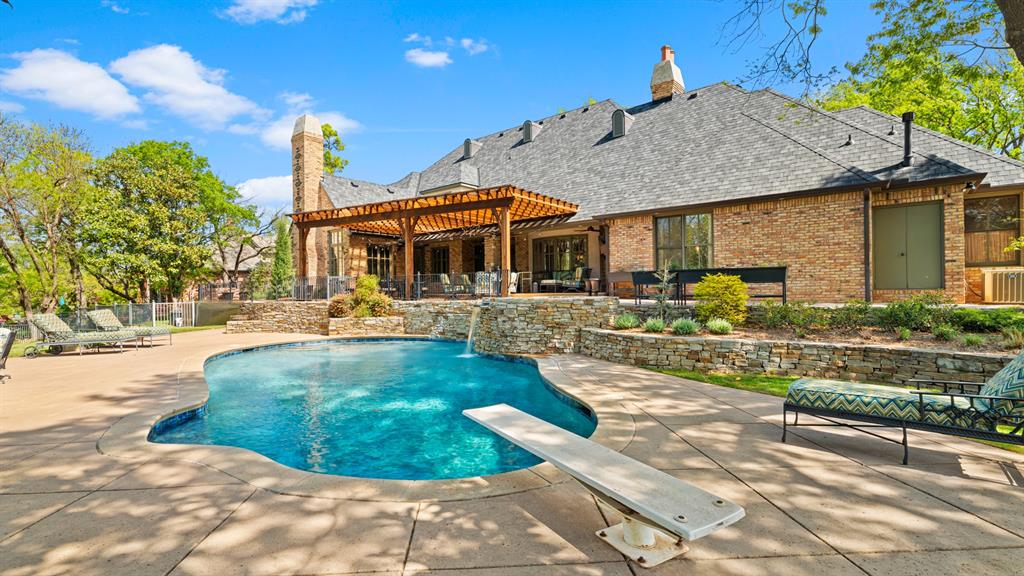 Set on just over three-quarters of an acre in Saratoga Farms, this 6,886 sq ft estate has the space, privacy, and finish you'd hope for at this level, and it's been meticulously cared for. The floor plan works just as well for a quiet weeknight as it does for a full house of guests. There are 4 generous bedrooms, 5 full baths, and 2 half baths, with several living and dining spaces that flow easily into one another. A private study makes working from home simple. The media room gives you a real theater feel for movie nights and game days. A butler's pantry sits between the kitchen and dining areas, so hosting a small dinner or a big celebration goes smoothly. Out back, there are no rear neighbors, just your own secluded retreat. The resort-style pool comes with a raised hot tub that spills over into it, so the yard feels like a getaway whether you're unwinding alone or entertaining a crowd. There's peace of mind built in too, with a whole-home generator and a Class 4 impact-resistant roof that's less than three years old. Homes in Saratoga Farms with this kind of care, privacy, and detail don't come up often. Schedule your private showing today.