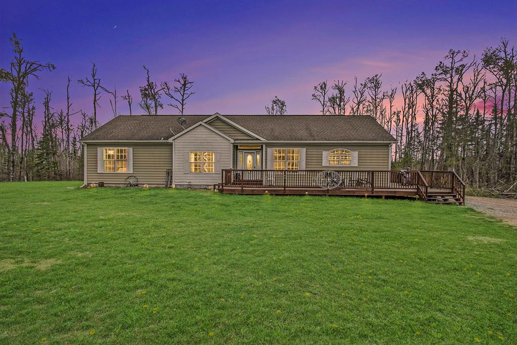 Tucked away on just over 20 acres, this updated 4-bedroom, 3-bathroom home (plus a non-conforming 5th bedroom) offers space, privacy, & room to roam. Thoughtfully updated by the current owners after purchasing it as a foreclosure, the home now features a spacious kitchen, tasteful paint selections throughout, & a generous walk-out basement with both a rec space and a cozy sitting area--perfect for relaxing or entertaining. Outdoors, three sizable sheds provide plenty of space for tools, toys, or hobbies. Nature lovers will appreciate the wildlife sightings right from the home, with deer and even the occasional bear making an appearance. Whether you're looking for peace & quiet, more space, or the ability to explore the outdoors right in your backyard, this property has it.
