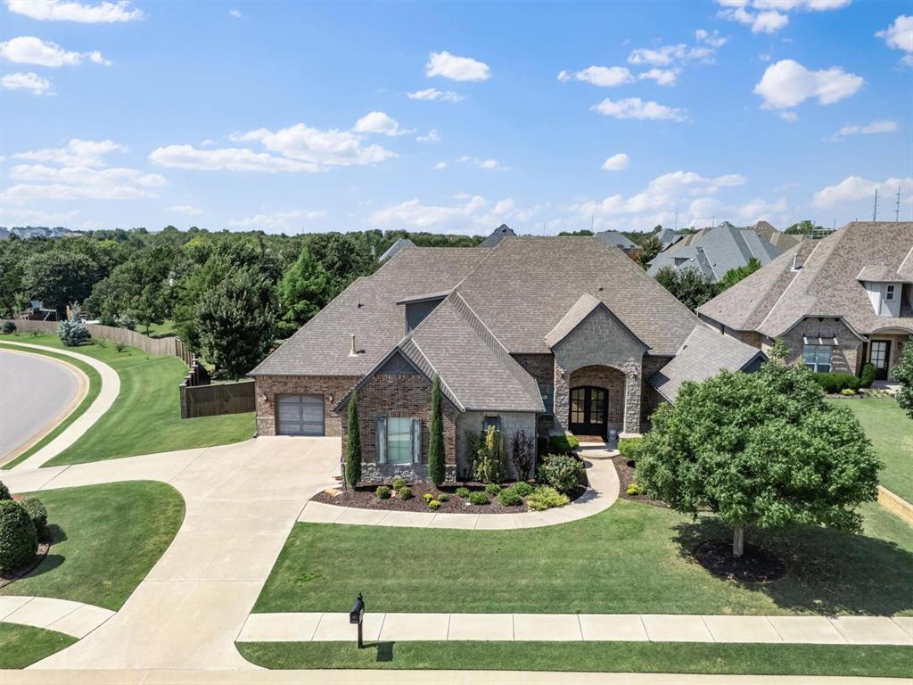 This exceptional Twin Bridges residence blends timeless elegance with modern comfort, offering over 3,300 sq. ft. of meticulously crafted living space. From the charming exterior to the regal double front doors and expansive 3-car garage, every detail has been designed to impress. Step inside the grand 14-foot entry, where wide-open sightlines, soaring 10-foot ceilings, and picturesque windows bathe the home in natural light while framing serene backyard views. The heart of the home is the gourmet kitchen—an entertainer’s dream featuring an oversized island, double ovens, extensive cabinetry, and both under- and over-cabinet lighting for a warm, inviting ambiance. A beverage bar and sophisticated dining area with a statement light fixture elevate gatherings, while the open layout seamlessly connects the living spaces. A private office with custom built-ins provides the perfect workspace, and a mud bench adds everyday functionality with style. The primary retreat is a sanctuary of luxury, complete with two vanities including dressing vanity, a walk-in shower, and a remarkable master closet with direct access to the utility room. With 4 spacious bedrooms, 4.5 bathrooms, and a versatile bonus room, the home effortlessly accommodates both comfort and convenience. Oversized garage bays further enhance the thoughtful design. Outdoor living shines with a large covered patio with fireplace overlooking the expansive backyard—ideal for both relaxing and entertaining. Nestled in a prestigious community, residents enjoy resort-style amenities including a pool, fitness center, playground, scenic ponds, and striking neighborhood entrances that set the tone for luxury living.