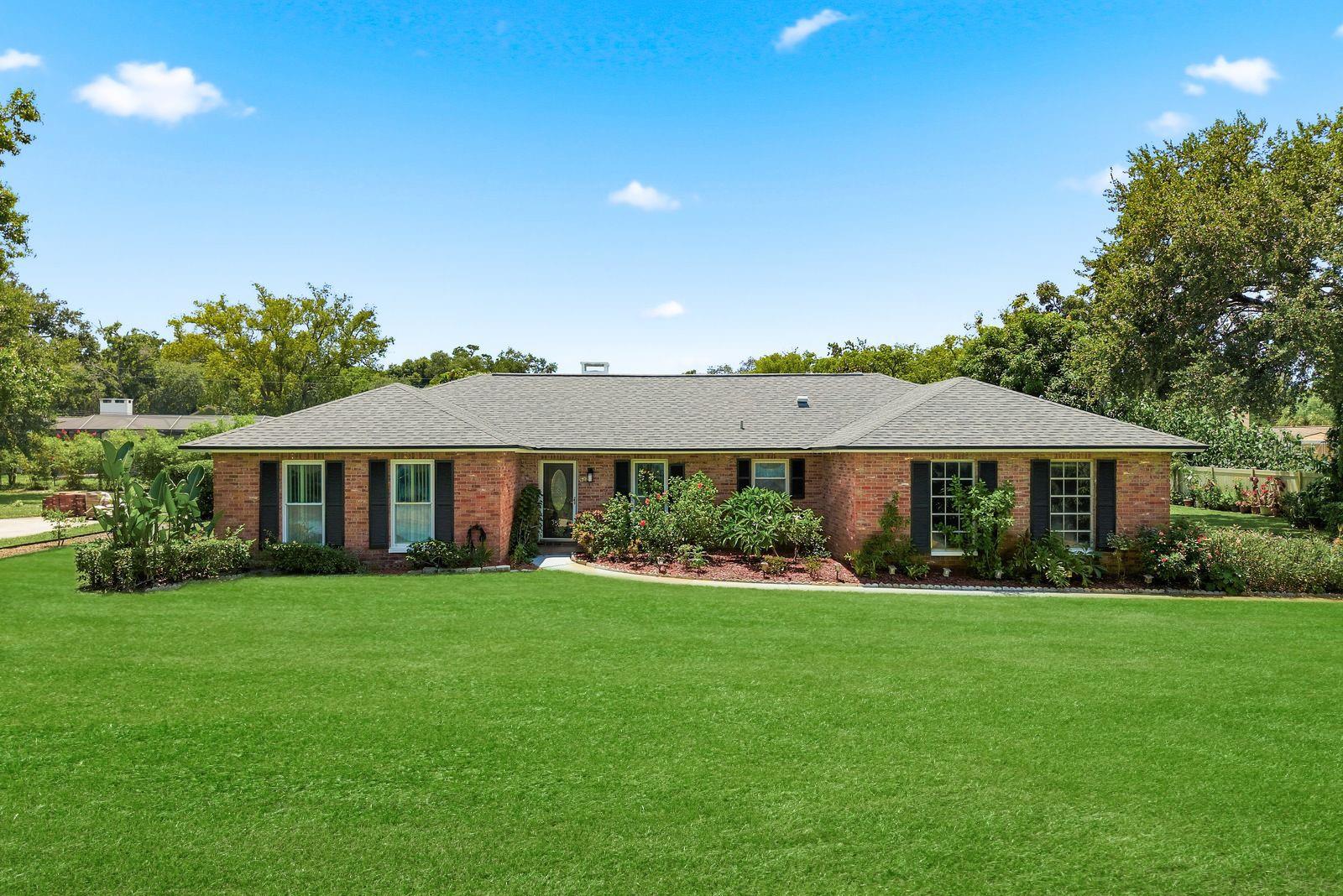 Looking for something genuinely different in a prime Clearwater location? This traditional four-bedroom, two-bathroom home rests on an oversized .42-acre lot, delivering the kind of elbow room that has become a rare commodity these days.Solid concrete block construction with handsome brick front accents signals quality that stands the test of time. A side-load two-car garage keeps the curb appeal clean, while mature landscaping frames the property with established charm.Inside, roughly 2,270 square feet unfold across a smart split floor plan. A formal living room and formal dining room set the stage for special occasions, while the spacious 20 x 14 family room, invites everyday relaxation. The updated kitchen shines with wood cabinetry, granite counters, newer stainless steel appliances, and a roomy walk-in pantry that any home cook will appreciate. A generous breakfast room and beautiful wood burning fireplace and a large interior laundry room round out the practical perks. Ceramic wood-tile flooring flows through the main living areas for effortless upkeep.Out back, the enormous yard is a blank canvas ready for a pool, garden, playset, or simply room to roam. Major updates bring peace of mind, including a roof from 2019, a new Trane heating and cooling system in 2026 and newer windows in 2012.The neighborhood keeps you minutes from beaches, shopping, dining, and easy commuting routes. Priced to reflect real value, this well-built home offers space and location in equal measure. Come see what different feels like.