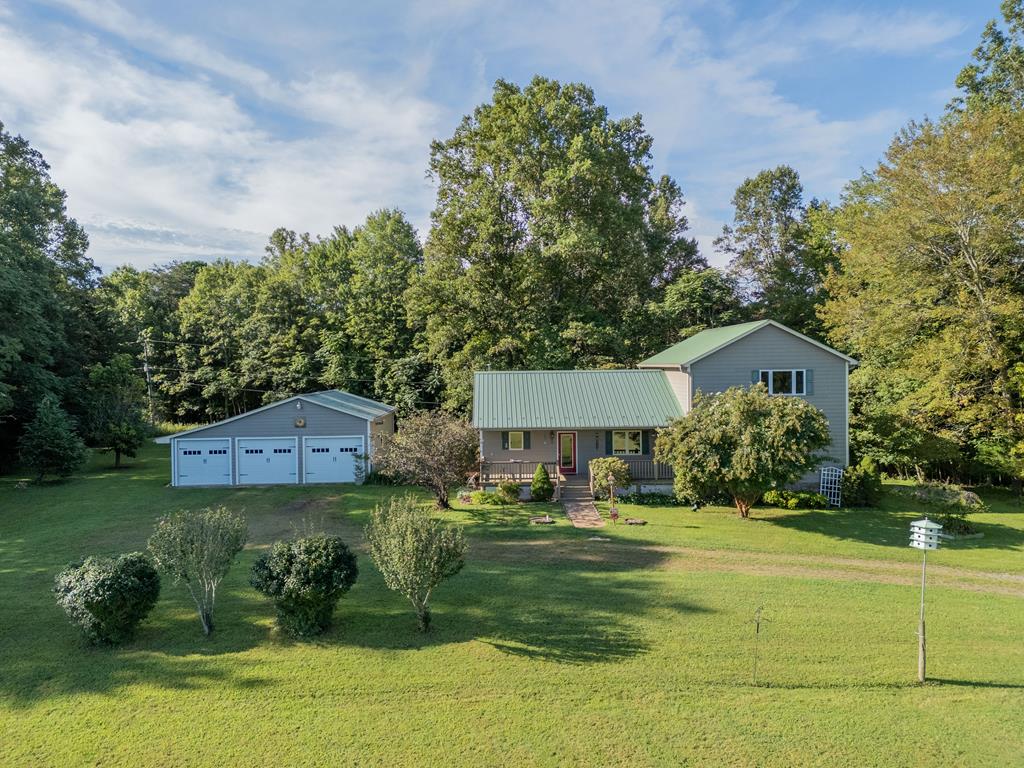 Nestled on 10+ picturesque mostly level acres, this serene property offers a blend of rural charm and modern convenience. Enjoy winter views of Bull and No Business Mountains from your front porch. This custom built, well-maintained home features 3+ beds & 2 baths. The largeprimary suite offers spectacular mountain views. The large covered back porch provides additional living space and opens onto a fully fenced back yard.A whole house generator ensures you are not without power. The exterior boasts quality Hardie plank siding, composite decking and a metal roof. The spacious detached garage has room for vehicles, equipment and workshop space. With level open pastures, mature trees, room for gardens and livestock, this property is ideal for hobby farming, homesteading, or simply enjoying peaceful country living. Just 10min to Stuart, 20min to Martinsville& 1hr to Winston Salem or Greensboro , enjoy privacy, nature, and a slower pace of life without sacrificing accessibility.