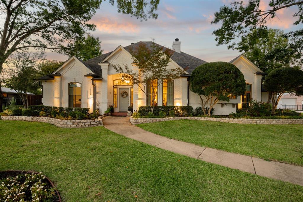 Multiple Offers, Offer Deadline Sat. Nov. 8th, 10AM. Brimming with warmth and sophistication, this beautifully appointed home in Sunrise Terrace showcases refined design choices and a thoughtful floor plan. Located in the heart of Colleyville and zoned for top-rated Grapevine-Colleyville ISD schools, the home offers convenient access to local parks, dining, and shopping in both Colleyville and nearby Southlake. From its classic architectural façade to its rich interior detailing, every space exudes character. The formal living room welcomes you with elegant millwork, high end sconces, and a gas fireplace, setting a gracious tone for entertaining. A double-sided fireplace connects the space to the inviting family room, painted in deep moody tones with built-in bookcases, designer lighting, and layers of texture. Just beyond, the study offers built-in cabinetry and a desk area. The kitchen blends timeless craftsmanship with chef-grade functionality featuring an Ilve range, cabinet-front Sub-Zero refrigerator, large Perla Venata Quartzite island, and walk-in pantry with double ovens. A wall of windows overlooks the backyard and bathes the space in soft natural light, while the adjoining sunroom—with brick floors, fireplace, and custom millwork—creates the perfect breakfast nook or cozy retreat. The utility room continues the home’s sophisticated palette with rich cabinetry, sink, microwave, and dishwasher, providing a beautiful yet practical workspace that can also serve as a butler's pantry. Outdoors, a pool and spa serve as the centerpiece of the beautifully landscaped backyard, complemented by a pergola, brick patio, and meandering garden pathways. The detached 1,200-sqft, climate-controlled workshop is a standout feature for car enthusiasts, complete with electric service, a lift, a storage loft, and a full workspace. An attached two-car garage provides additional parking. This home is a true blend of craftsmanship, comfort, and character—a rare Colleyville find.