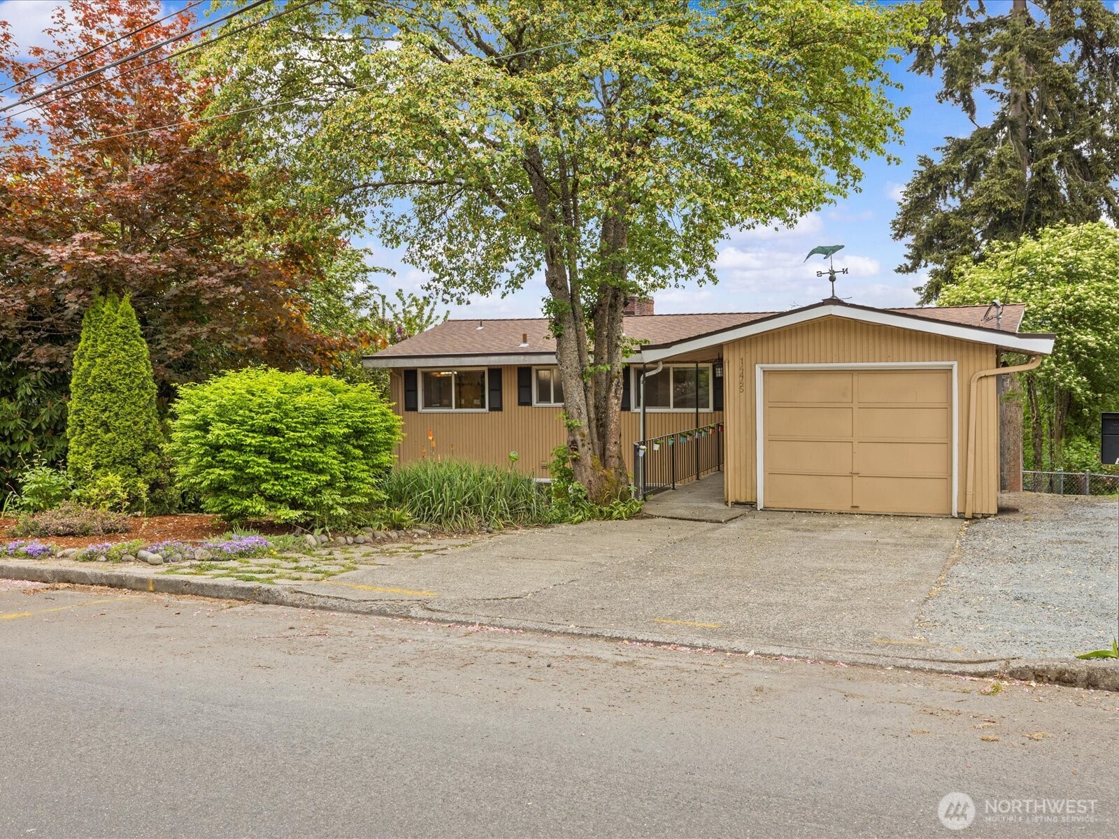 Storybook charm meets modern comfort in this immaculate 1957 rambler with a daylight basement. Bathed in natural light, this spacious home offers 4 bedrooms plus a den and 3 bathrooms—room for everyone. The main level features a great room layout with gleaming hardwood floors and a sunroom perfectly positioned to capture territorial, mountain, and partial Puget Sound views. The beautifully updated kitchen showcases designer countertops, stainless steel appliances, and a farmhouse style sink. The generous primary suite includes a luxurious 5-piece bath with a soaking tub, double vanity, and an oversized dual-head shower. The lower level is ideal for entertaining or multi-generational living, complete with a second kitchen or bar area, wine storage, and an expansive rec room—perfect for gatherings or a potential MIL/rental setup. Meticulously maintained with a newer 3-year-old roof and updated PEX plumbing. The level, partially fenced backyard offers endless possibilities for gardening, play, or relaxation. Conveniently located near downtown Burien with easy access to shopping, dining, and major routes. A must-see home that blends timeless character with thoughtful updates! Don't miss this one!