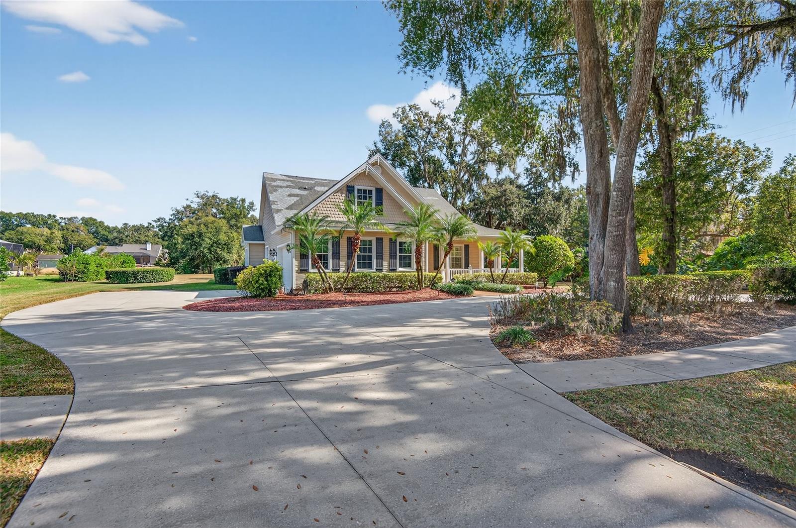 Welcome to this stunning Southern-style home located in the highly desirable Sam Allen Oaks community of Plant City. From the moment you arrive, you’ll appreciate the exceptional curb appeal—mature oak trees, manicured landscaping, palm-lined walkways, and a wide circular driveway create a grand and inviting first impression. Step inside to an elegant and welcoming layout featuring high ceilings, crown molding, architectural archways, tile flooring, and generous natural light throughout. The spacious formal dining room showcases tray ceilings, decorative molding, and ample room for hosting holidays and special gatherings. At the heart of the home is a beautifully designed chef-inspired kitchen offering rich wood cabinetry, Quartz countertops, a center island with cooktop, stainless steel appliances including double wall ovens, and a bright breakfast nook framed by plantation-shuttered windows overlooking the backyard. The kitchen opens seamlessly to the living area—perfect for everyday comfort and easy entertaining.The living room provides an inviting atmosphere with tile flooring, abundant windows, and stylish wall accents, along with a convenient pass-through bar from the kitchen. The primary suite is a true retreat, featuring a tray ceiling, plantation shutters, warm wood flooring, and an expansive layout with room for a sitting area. The primary bathroom offers a spa-like experience with dual granite vanities, a dedicated makeup vanity, rich wood cabinetry, upgraded lighting, and a relaxing soaking tub. The beautifully tiled walk-in shower features decorative stone insets, oil-rubbed bronze fixtures, and built-in shelving.Enjoy year-round Florida living in the spacious screened-in lanai, complete with high ceilings, tile flooring, and peaceful views of the lush backyard and surrounding greenery. It’s the perfect outdoor space for morning coffee, quiet afternoons, or hosting guests. This home offers timeless style, space, and comfort in a peaceful setting just minutes from shopping, dining, and commuter routes. Homes in Sam Allen Oaks rarely become available—don’t miss this opportunity to make this exceptional property yours. just move right in. Call and make your appointment today to see! All information contained herein subject to change without notice. Property is sold ‘as is’ with no warranties expressed or implied. *Seller used 3rd bedroom as an office and removed the closet installed wall to wall bookshelves do not convey* New flooring being installed in this room that was the office. Other features, sprinkler system and central vacuum