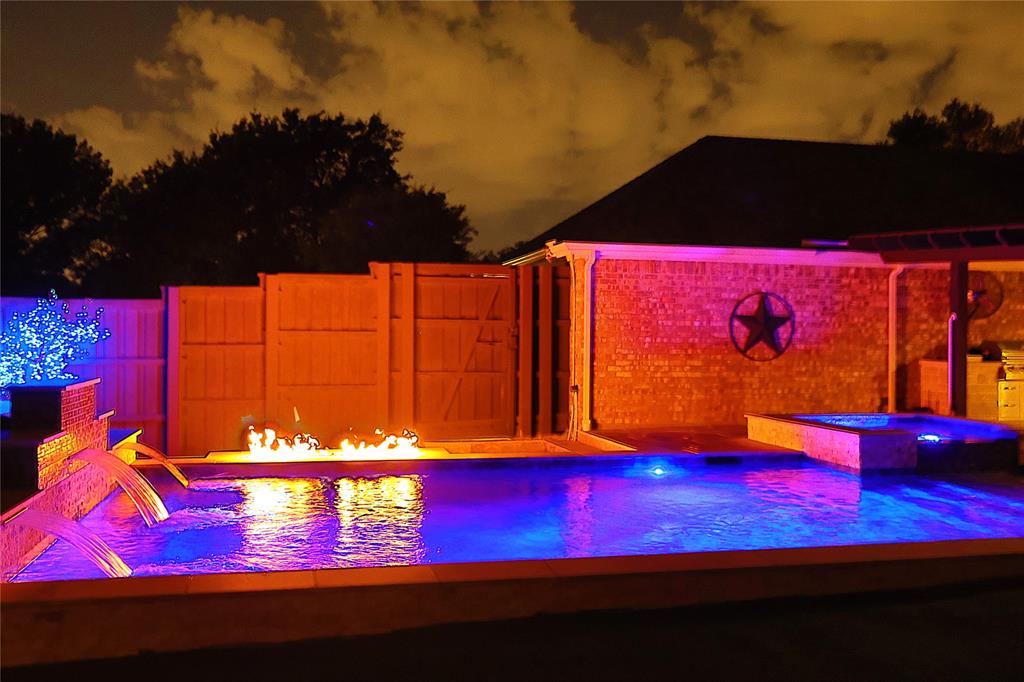 An absolute gem in central Frisco that is truly a must see. You simply won't believe this custom backyard with pool, spa, fire pit, built in grill and maintenance-free turf. Going beyond just what you see, the home offers a Generac whole-home generator to ensure you stay up and running in any situation. As you pull up to the front of the home, you'll find a well-manicured yard and garden. Throughout the interior you'll find hard floors, open spaces, and views over your backyard escape. Right inside the front door you'll find French doors that open to the first office space. Continue through the foyer to find a formal dining and the open living area with a gas fireplace. The kitchen features a gas range with double oven, granite counters and stainless steel appliances. The primary suite is privately tucked away from the other rooms in the home and features a gorgeous bath with split vanities, separate tub and shower, and a custom closet. You'll also find a connected flex room great for a second office or otherwise. A European split-unit AC in the primary suite allows you to cool the room to ideal sleeping temperatures without impacting the rest of the home. A long list of additional features of this home includes a large storage shed, extended parking in the driveway, newer roof and water heater, and much more. Truly an opportunity you shouldn't miss.