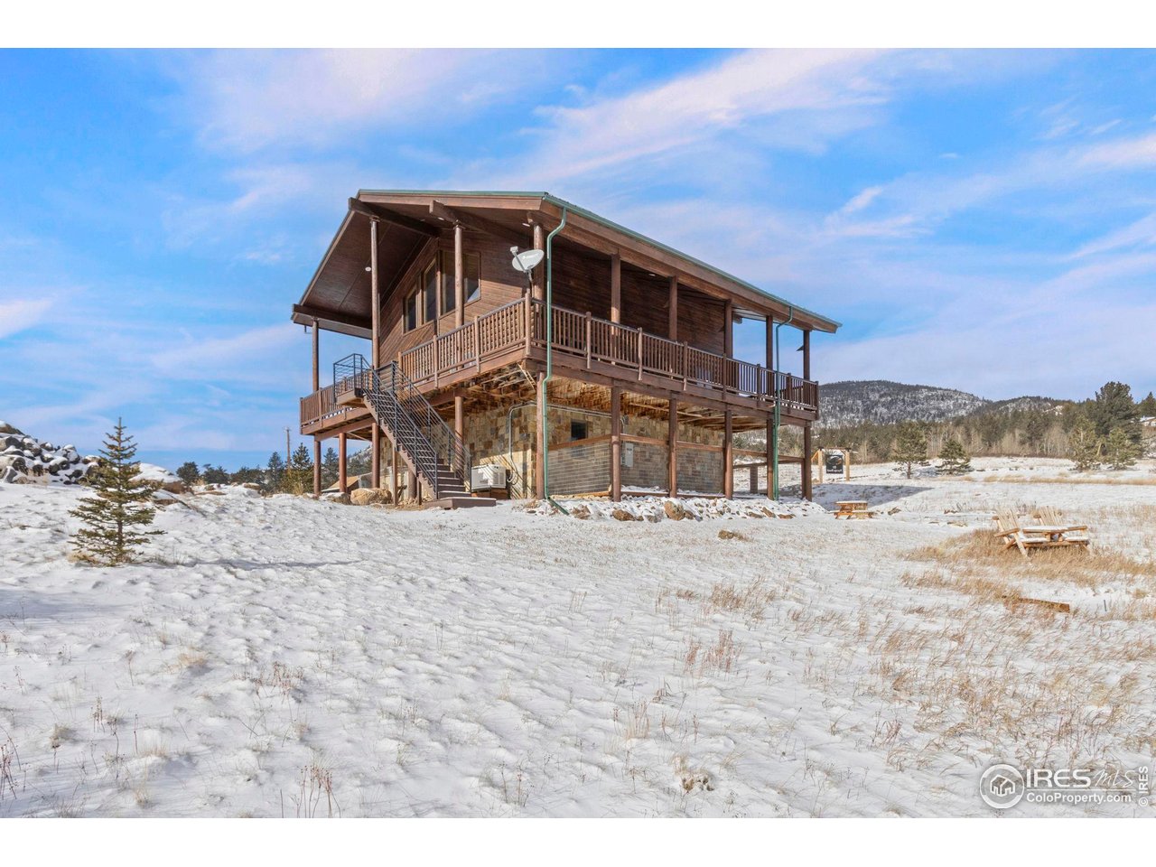 Come see this renovated Swedish Cope Log home located on 2.6 acres in a close-in filing of Crystal Lakes. All logs have been newly stained and chinked, inside and out. Highlights of the interior include dramatic timber framing with tongue and groove ceiling, and amazing natural light throughout. This luxurious home features heated bathroom floors, double vanity and high-end shower tile installation. Gourmet kitchen includes custom cabinetry, Jenn-Air appliances, granite counters, stone backsplash and a view of the Aspen grove to the East. Upper loft area is 16' x 23', carpeted and opens to great room below. Lots of opportunities here for family room, office, etc. The lower level bar has been recently installed in the previous family room and can easily be relocated. Home has tankless water heater, forced air furnace with humidifier, and backup power generator for peace of mind and security. The attached garage is 31' x 15' and can typically accommodate a car and ATV. Step outside to see the stunning sunrises and sunsets from the covered, wrap-around deck. This top of the line cabin checks all the boxes! It's the perfect year-round home or part-time vacation spot in the mountains of Red Feather Lakes. The HOA includes fishing passes to incredible private fishing lakes and streams, just minutes away. If you're looking for convenience and quality in a mountain cabin, you've found it!