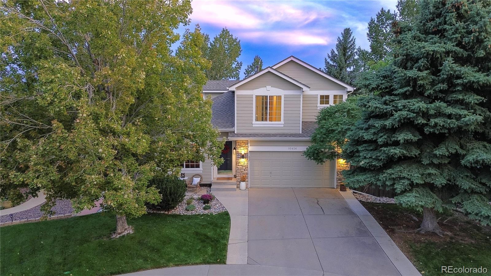Perched on a lush cul-de-sac lot with mountain views, this gorgeous home offers a rare and private setting, as well as several flex spaces for you to personally create the functionality you need. A charming curb appeal welcomes you to 3 bedrooms, 3.5 baths, open layout, walk-out lower level with large bonus room and 2-car garage. The upgraded kitchen with custom knotty alder cabinets and vast storage is further warmed with granite, stone and wood.  A portion of the island can be converted into a stand-alone table to adjust the room to your liking. A cozy fireplace and gorgeous mantle anchor the other end of the great room, offering everyday comfort and elegant entertaining where kids, guests and cooks can intermingle. The rich lounge-like dining & living room graciously hosts your evening cocktails and holiday meals. Vaulted ceilings provide an airy feel with large windows to peer out into the greenery, as if you are in a treehouse.  The inside seamlessly flows to the outside onto the deck and lower patio. A designer palette with Oak/Brazilian hardwood floors, as well as new high-end soft wool carpeting, set the stage for a contemporary, durable lifestyle. Upstairs, a hardwood hallway leads to 2 bedrooms and full bath. The large primary bedroom connects to an en-suite bathroom where the walk-in closet holds a laundry shoot connected to 2 laundry hook ups to choose from: main floor or lower level. A vaulted ceiling and large window with views adorned the retreat. The lower level features a big great room with built-in shelving for flex space use as a 2nd tv area, a guest suite, playroom, home gym or combination of them all. A separate office with a lovely paned glass door is great for working from home.  A bathroom re-modeled in 2025, as well as backyard and patio access complete the area. This is a special one-owner home in the highly coveted, quaint Fairway Vista ll community where listings are rare. Come see it today!