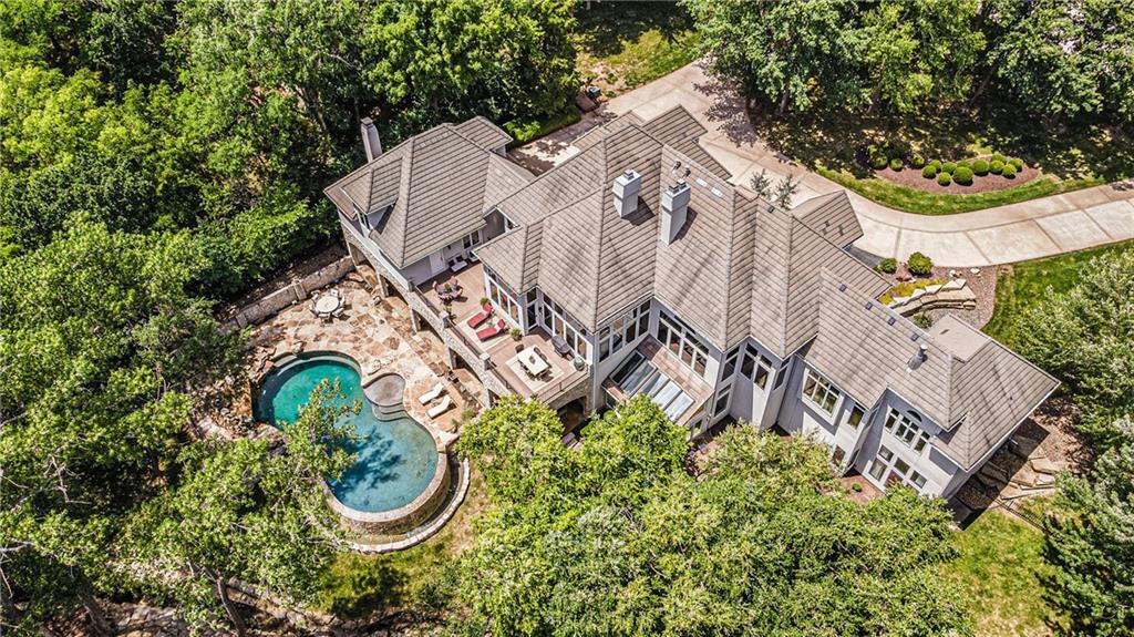 WELCOME TO YOUR DREAM HOME AND PRIVATE OASIS!  This estate home is positioned on over 2.05 acres of manicured ground, touching over 600 ft of stunning fairway at the coveted Lakewood Oaks Country Club golf course. This home was fully transformed 2007-08. Over 10,600 sqft of indoor living, a covered outdoor entertaining space, 4 kitchens, 6.3 total baths 4 gas fireplaces, a private apartment above the garage, 1100 bottle temperature controlled wine room, spacious theater/game room and so much more! 

This home is an Entertainer's Dream with a huge heated salt water gunite infinity edge pool and hottub.  The grotto and waterfall will definitely amaze your guests. In addition, your stone covered outdoor kitchen and flagstone slab floors, beautifully boasts the  backyard space overlooking a top design stone lined creek. The Elan home automation system lets you control home lighting, pool, hot tub controls, security and other electronics from any location.
 The homes 15 and 16' ceiling height making it feel to grand!! No need to go to the gym when you have your spacious work out room right at home. The 6 car garage with epoxy coated flooring and has plenty of room for your cars and big toys! Viking appliances (double oven, refrigerator and 54" gas range) will make cooking a breeze. Come view this beautiful home and make your dreams come true!!
