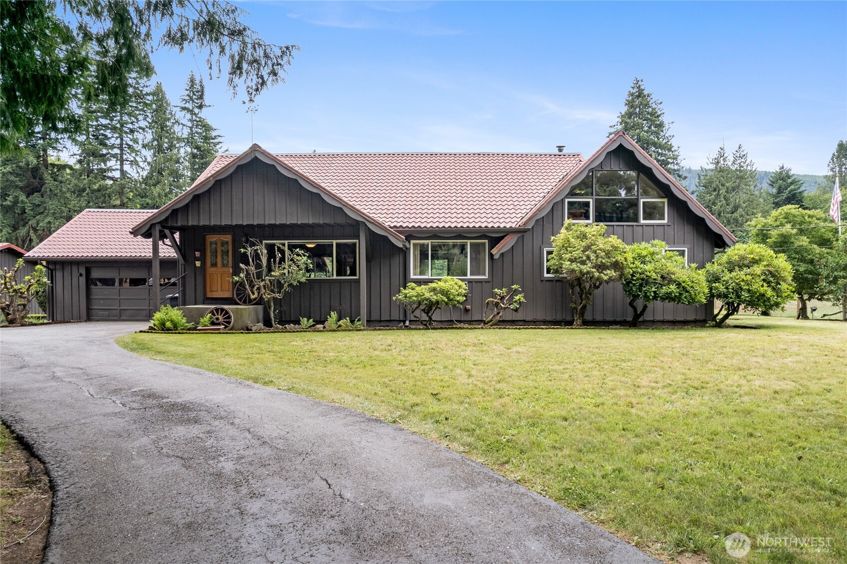Welcome home to this charming farmhouse that perfectly blends timeless character with modern comfort. The open-concept floor plan features spacious living areas filled with natural light, vaulted ceilings, four generously sized bedrooms, two newly renovated bathrooms, a large newly renovated utility room, radiant floor heating, instant hot water heater, and an upgraded kitchen complete with stainless steel appliances, double oven, granite countertops, and beautiful maple cabinetry. Situated on 6.87 level, fully fenced and cross-fenced acres, this exceptional property is thoughtfully designed for country living while still being close to local amenities and restaurants. Enjoy three separate pastures, an attached garage, a large 30x40 two-bay shop with power, and a well-appointed barn featuring four private stalls, a tack room, and a hay loft. Additional highlights include fruit trees, garden space, and a 18x24 woodshed that is partially enclosed for additional storage. This stunning, one-of-a-kind homestead offers the perfect combination of comfort, functionality, and rural charm. Don't miss this rare opportunity to make it your own.
