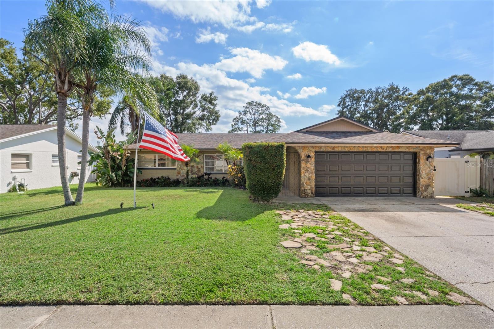 Step into the relaxed Florida lifestyle at 1407 Garden Avenue, a beautifully updated and spacious home in the heart of Tarpon Springs. Offering 3 bedrooms, 2 baths, and a versatile den that can serve as a 4th bedroom or home office, this property provides the perfect balance of comfort and flexibility.

Inside, the home feels open and inviting, with multiple living areas that flow easily from one to the next—perfect for family gatherings or quiet evenings at home. The kitchen features stainless steel appliances and overlooks one of the main living spaces, creating a natural hub for entertaining. Throughout the home, you’ll find tile flooring and hardwood in the bedrooms—no carpet—along with updated bathrooms and a new roof that ensures years of worry-free living.

The Family Room opens to a screened porch and a fully enclosed inground pool area, ideal for enjoying the Florida sunshine year-round. The backyard is completely fenced, offering privacy and space for pets or outdoor activities. With no HOA or CDD, you’ll have the freedom to enjoy your property your way.

This home has never flooded, including during recent storms, giving you added peace of mind.

Located just minutes from the Gulf beaches, the historic Sponge Docks, and lively downtown Tarpon Springs, you’ll enjoy boutique shopping, local festivals, and waterfront dining right at your doorstep. The nearby Pinellas Trail offers miles of scenic paths for biking or walking beneath the oaks.

Spacious, thoughtfully updated, and full of character—1407 Garden Avenue is the kind of home where comfort meets coastal charm. Come experience why Tarpon Springs is one of the most beloved communities on Florida’s Gulf Coast.