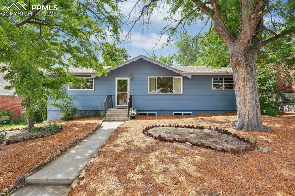 Imagine coming home to this charming mid-century ranch in central Colorado Springs. Offering the perfect blend of timeless character and tasteful updates, this 1,700-square foot gem has three bedrooms and two full baths. Enter to gleaming hardwood floors in the living room, with an open concept dining area off to one side. The heart of the house, a large, updated kitchen with tons of counter space, is bright and airy, making meal prep a delight. Two bedrooms with generous closets share the large full bath on the main level. Downstairs, newer carpet adorns a big family room area, an enormous laundry room that could also host workout equipment, and a junior suite with attached bath fit for a queen! New furnace/AC in 2023! New water heater 2022! Attached is a one-car garage with plenty more space for parking in the back of the home with alley access. Situated on a spacious 6,026 sq ft lot in a well-established neighborhood, this home offers warmth, privacy, and pride of ownership. Plus, the location can’t be beat—just minutes from UCCS, local parks, shopping, and quick access to I-25.