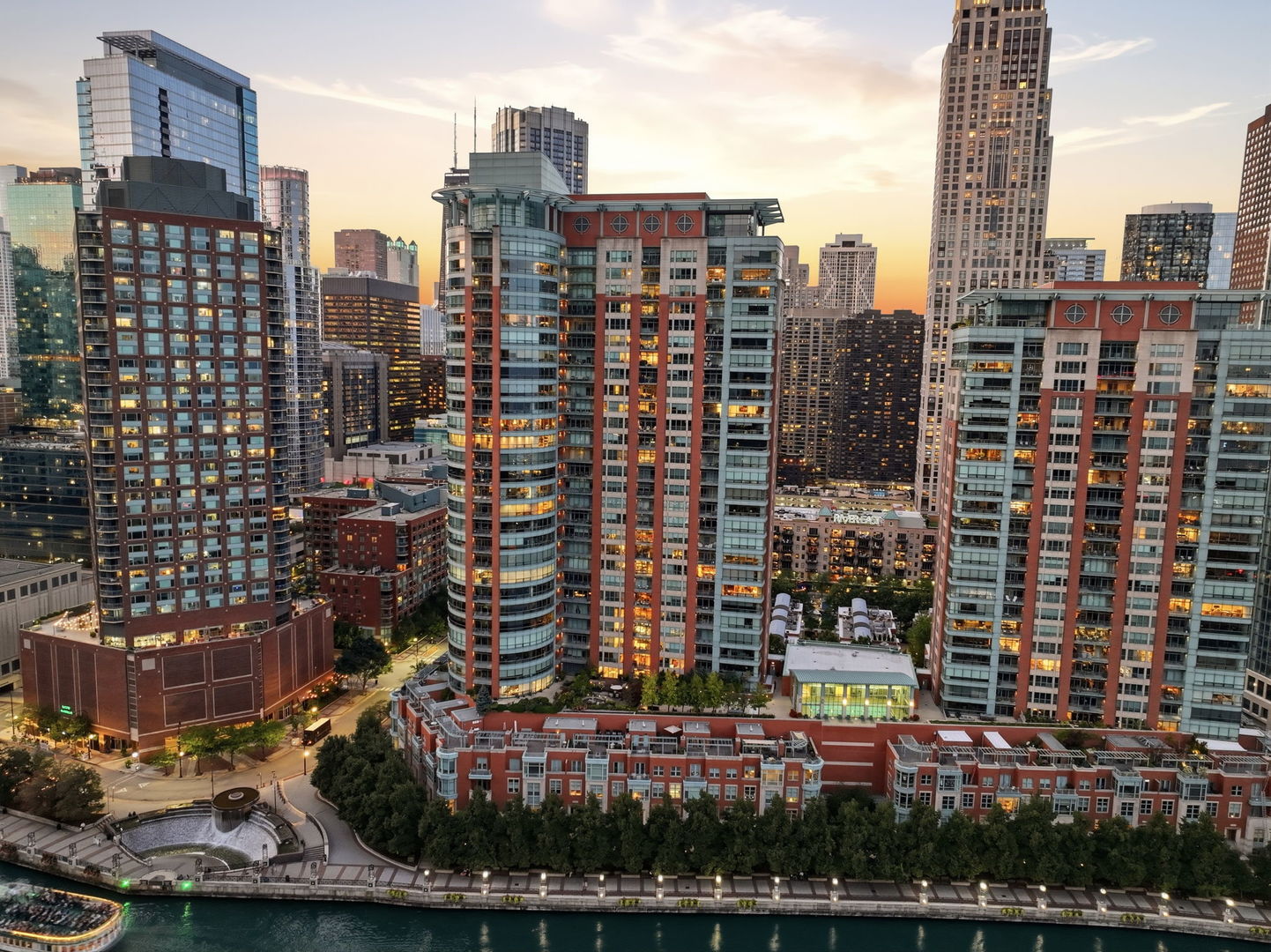 Welcome to an extraordinary residence at RiverView West, where expansive interiors, dramatic city views, and an exceptional waterfront setting come together in one of Chicago's most coveted locations. Spanning an impressive 4,705 square feet, this sophisticated three-bedroom, three-bath residence offers grand-scale living framed by floor-to-ceiling windows and breathtaking views of the Chicago skyline. Designed for both elevated entertaining and everyday comfort, the expansive open-concept living and dining spaces flow effortlessly into a beautifully appointed gourmet kitchen featuring high-end appliances, generous cabinetry, and an oversized island. At the heart of the home, a striking dual-sided fireplace creates an elegant focal point between the living and dining areas while adding warmth and ambiance to the space. Each of the three generously proportioned bedrooms is thoughtfully designed as a private retreat, complete with its own en-suite bath. The residence is further distinguished by exceptional private outdoor space, with four balconies, including one off each bedroom and an additional balcony off the den offering multiple vantage points to enjoy morning coffee, evening cocktails, and sweeping city views. RiverView West offers an impressive collection of building amenities designed for comfort, convenience, and an elevated downtown lifestyle, including a clubhouse, exercise facilities, swimming pool, 24-hour door staff, and building security. Perfectly positioned near the Chicago River, Lake Michigan, Navy Pier, and the lakefront, this exceptional location places some of the city's most iconic destinations just outside your door. Michigan Avenue's renowned shopping, dining, and entertainment are approximately a 10-minute walk away, while the Riverwalk, Navy Pier, lakefront recreation, and countless downtown destinations are all within easy reach. The surrounding waterfront is poised to become even more connected with the development of DuSable Park and planned pedestrian connections linking the Chicago River waterfront with the Lakefront Trail/Flyover and Navy Pier area, further enhancing an already exceptional location. An extraordinary opportunity to own more than 4,700 square feet of refined living with remarkable private outdoor space, iconic views, full-service amenities, and an enviable waterfront address just moments from the best of Chicago.Two parking spaces are available for purchase separately at $50,000 each.