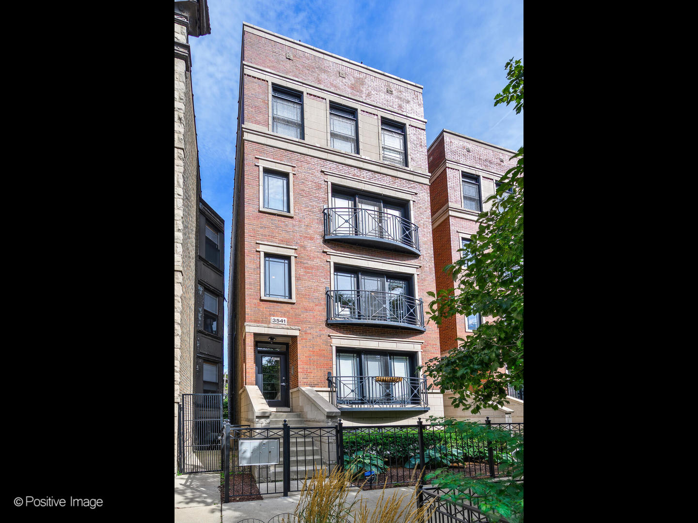 Located in the heart of Wrigleyville on a tree-lined, one-way street, this beautifully updated 2-bedroom, 2-bath home offers classic Chicago living, elevated with thoughtful transitional updates. Step inside and you'll notice rich hardwood floors, crown molding, and a stately fireplace anchoring the living space. Large glass doors open to a Juliet balcony and treetop views creating a sense of calm. The spacious floor plan easily accommodates a dining area plus a cozy nook for reading or a desk setup. The remodeled kitchen is the showpiece of the home, blending modern function with timeless design. Quartz countertops, custom millwork, high-end appliances, designer tile and hardware, and a walk-in pantry make it as practical as it is beautiful. The primary suite is a true retreat with a custom walk-in closet and spa bath featuring a steam shower, heated floors, whirlpool tub, and dual vanity. An adjacent back deck extends your living space outdoors, the perfect spot for morning coffee or winding down after a lively Cubs game. The second bedroom is generously sized and ideal as a guest room or home office. Parking and storage are included, and all four units are owner-occupied in a well-maintained association. Just steps from Wrigley Field, the Addison Red Line, and the energy of Clark Street, this home captures the essence of classic Chicago living in one of the city's most vibrant neighborhoods. Welcome home.