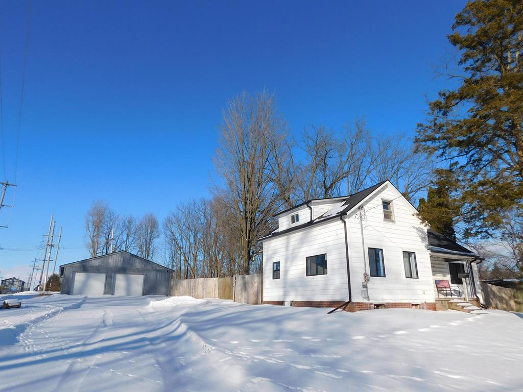 Charming home, sitting atop a hill, on a large lot that gets great sun! The home offers a large living room, main floor laundry, Kitchen with plenty of counter space and cupboards for all your storage needs.  On the main level you have two bedrooms and a third on the upper level. The home has been tastefully upgraded with new luxury vinyl floors, carpet, paint, roof and some new windows.   The extra large garage with added work shop in the back gives you all the space you need to park your cars/toys and still have space to get done anything you could need to do.  This home has everything you could want in a great location. All that's left for you to do is move in and make it yours!