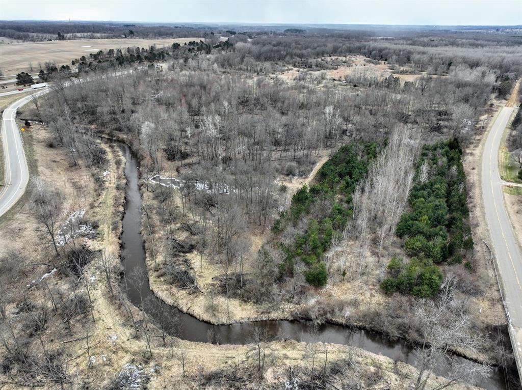 This property located near Olivet in Eaton County offers a combination of recreational land features, water frontage, and land management potential. The parcel includes over 1,000 feet of frontage along Indian Creek, which adds a natural water source and contributes to the overall diversity of the landscape.The property has recently undergone a timber harvest, resulting in a mix of open areas, regenerating vegetation, and remaining stands of timber. Tree species on the property include oak, maple and walnut. This combination of hardwoods and early successional growth provides varied cover and habitat structure. Buyers interested in land stewardship may find opportunities to guide future growth and habitat conditions through selective management practices.An established trail system runs throughout the property, allowing access to different areas of the land. These trails can be used for walking, recreational riding or accessing hunting locations.The layout supports access to the parcel and provides the ability to reach both wooded sections and open areas with relative ease.Existing food plot provides a great draw for local wildlife. This area, combined with gently rolling timbered ridges and water from the creek, contribute to a setting that can support wildlife such as deer and turkey, which are common in the region. The surrounding area includes larger privately held tracts that are managed for wildlife habitat, contributing to a landscape that supports consistent and above average wildlife populations.Planted pine trees are located along portions of the property and serve as thermal cover and a visual screen from the road. These plantings also contribute to long-term habitat structure and diversity. The mix of open ground, hardwood timber and conifer cover creates a range of conditions across the acreage.The property includes paved road frontage with a gated entrance, providing defined and controlled access. A well is located on the property, and there is potential for a future build site, subject to loc Current use is Farm,Hunting,Other,Recreational,Residential.