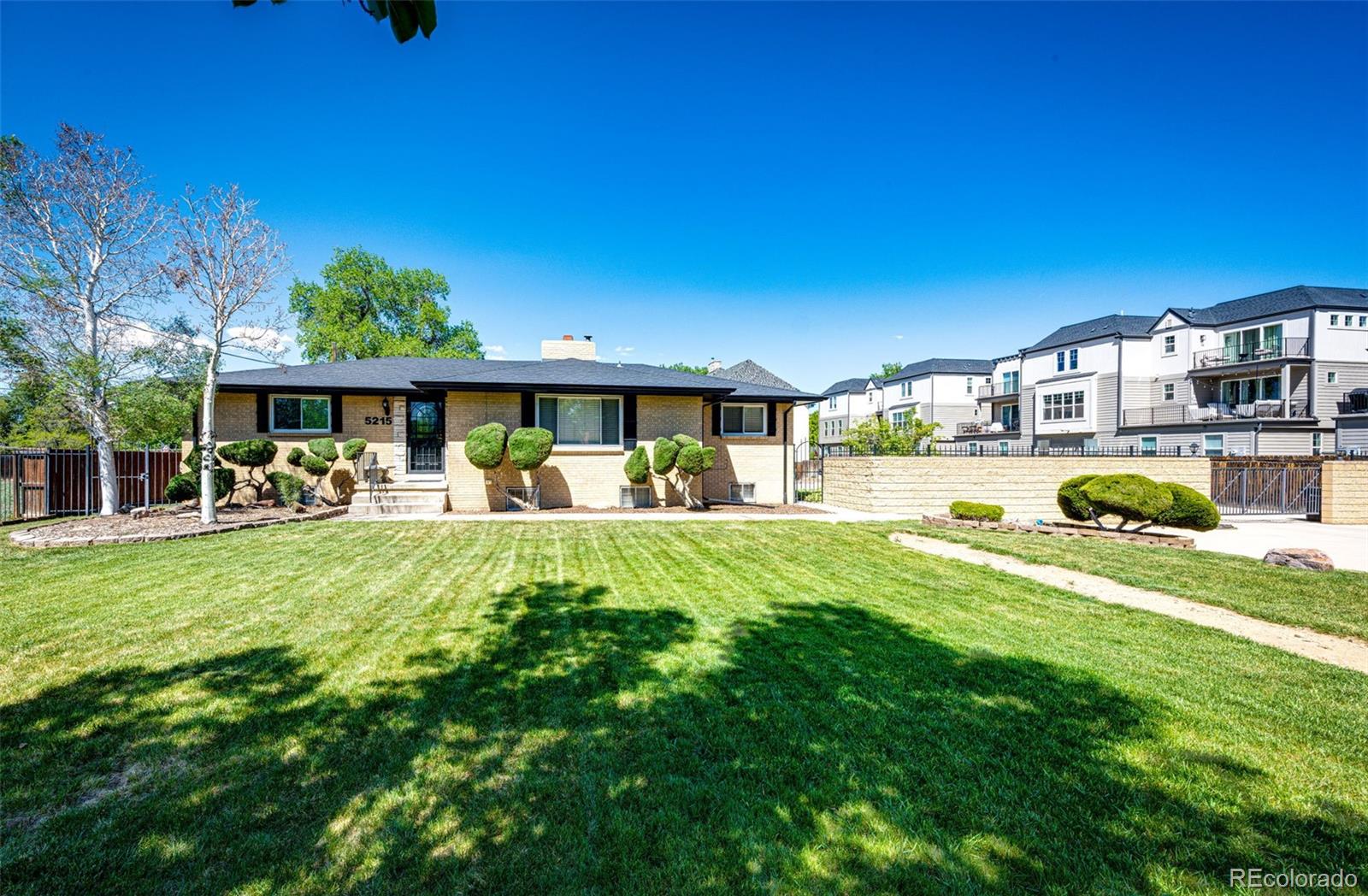 New Listing in Olde Town Arvada! One of kind property a very unique 1/2 acre Lot! This amazing all-brick ranch features a spectacular courtyard setting with a fully fenced yard and electronic gate for added privacy and security. The main level offers three bedrooms, two baths, a very spacious living room, formal dining area, and a beautifully updated kitchen. The kitchen is finished with deep espresso cabinetry, quartz countertops, stainless steel appliances, and opens to an enclosed patio that creates the perfect indoor-outdoor entertainment space. Expensive hardwood floors run throughout the main level along with beautifully finished plaster walls that add warmth and character.The basement is partially finished with concrete floors heated by boiler, two non-conforming bedrooms, a three-quarter bath, large laundry area,  offering plenty of flexibility and storage space. One of the standout features of this property is the incredible courtyard and detached commercial-style garage with heat. The oversized garage can accommodate up to eight vehicles, features taller overhead doors, and includes a lift for vehicle maintenance or hobby use. Conveniently this property is close to shops, restaurants, nightlife, and all the charm the area has to offer. Fully Fenced with electric gate entry to courtyard.  This is truly a rare opportunity in a prime location. The Sewer from the Main in Street to House has been replace with new system. We are also offering the adjacent lot separately from this property , check for pricing with Listing  broker,  if you want to indulge in  creating a rare opportunity for an incredible assemblage totaling nearly one acre in the city. Whether you are looking for additional privacy, future development potential or simply a one-of-a-kind estate setting near Old Town Arvada, this combination is extremely hard to find. You could build an extended family site next door.