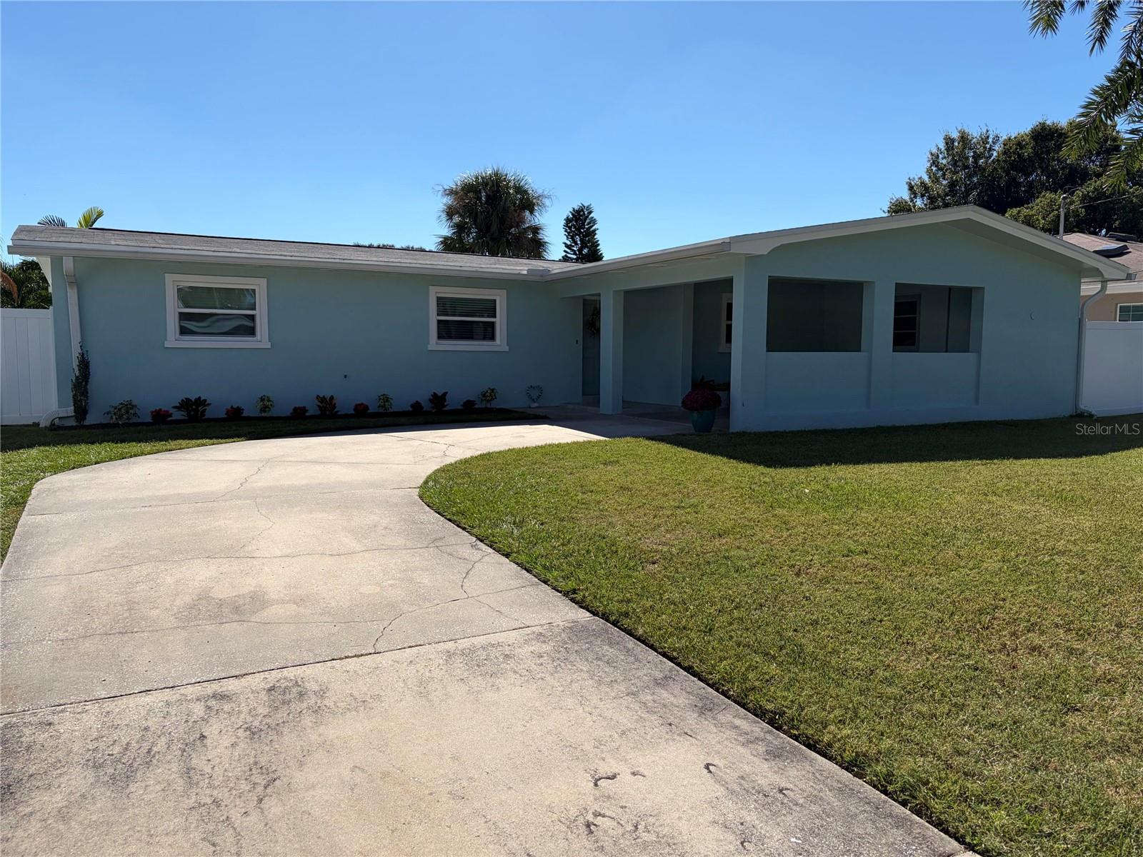 We're pleased to present the opportunity to acquire a rare gem property in a highly demanded Lakeside Terrace neighborhood in Dunedin, FL. This home is high and dry with no flood insurance required. Including 3 bedrooms and 2 bathrooms, you are going to enjoy the 1483 sqft that composes this House.  Less than 1 mile to Dunedin's well known downtown featuring restaurants, breweries and shopping and walking distance to sunsets, parks, schools, churches and the Pinellas Trail. The home is updated featuring a newer kitchen with granite countertops and stainless steel appliances, modernized bathroom updates, a new roof in 2022, on demand hot water heater, PGT Hurricane Windows throughout the entire home, AstroGuard Hurricane Fabric installed for the rear sliding glass door and laundry room door, extra large pocket sliding glass door that collapses into the wall leading into fully screened porch, indoor laundry room featuring extra large LG washer and dryer, large custom paver patio and walkways around sides and rear of home, master bedroom with walk-in closet and full bathroom, covered parking and a recently painted interior and freshly painted exterior using Sherwin-Williams Paint. This home is move-in ready. Don't miss this great opportunity and don't be the last to schedule your visit today!