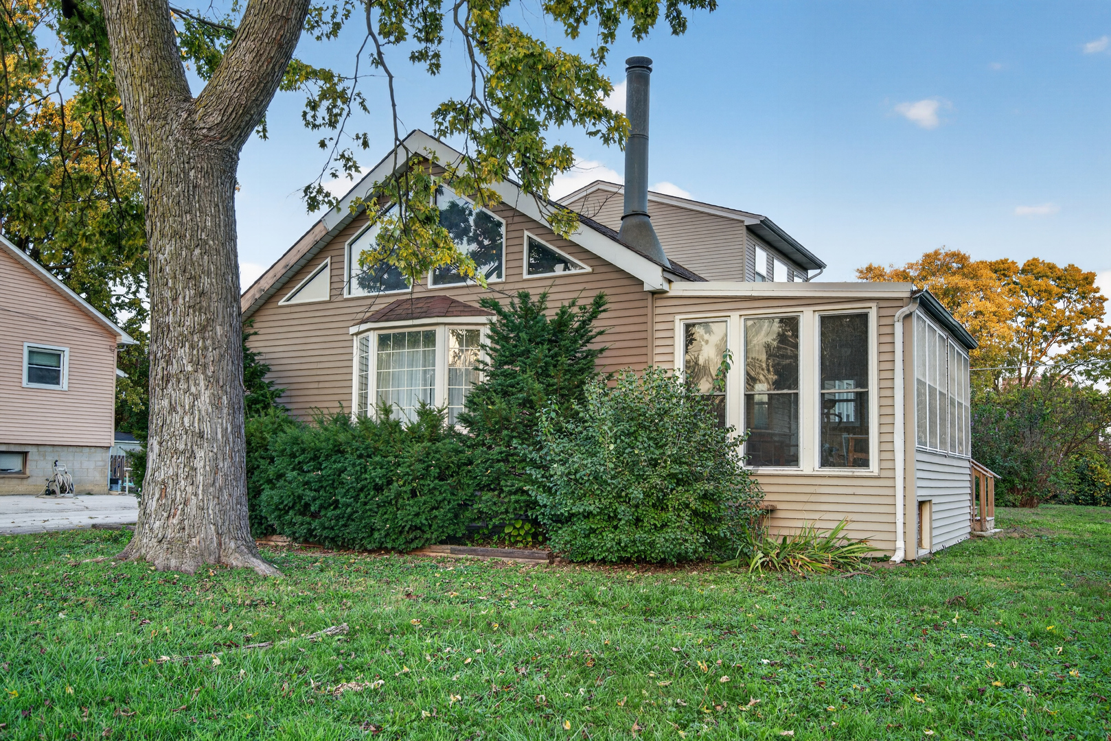 Discover this spacious 3-bedroom home with a bonus room and 2 full baths in Midlothian! Situated on a double lot at the quiet end of the street, this home offers plenty of room to spread out and make it your own. Features include hardwood floors, a generously sized kitchen, an expansive living room, and a large third bedroom. Additional living space includes a bonus room and a sunroom, offering flexibility for relaxing, working from home, or entertaining. A dedicated bar area makes hosting family and friends a breeze. With generous interior space and an oversized lot, this property presents a wonderful opportunity for buyers seeking space and potential. Property is being sold AS-IS. New water heater. Don't miss your chance to explore all the possibilities this home has to offer!
