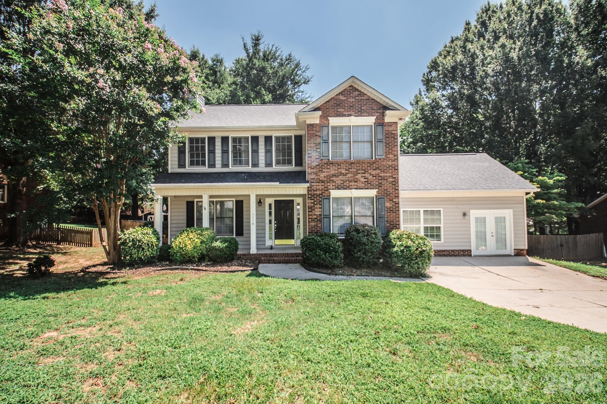 Nestled in the heart of Harrisburg, this freshly painted move-in ready home has so much to offer! Restaurants, grocery stores, parks, farmers markets and so much more within walking distance while Harrisburg Park, Harrisburg Town Center, Concord Mills, Charlotte Motor Speedway and UNC Charlotte are all just a short drive away. This home is easy to entertain in with a large living room featuring gas log fireplace, an eat-in breakfast area, separate formal dining room and a huge flex room with built-in cabinetry that would be the perfect great room, a possible fourth bedroom or even for multi-generational living with its separate entrance. Relax on the rear deck shaded by mature trees overlooking an over-sized flat private backyard that is fully fenced in - the perfect place for recreation and entertainment. Upstairs features three bedrooms and two full baths with a master suite that has separate shower and tub and spacious closet. Laminate flooring throughout the home for easy maintenance free living. Book your showing today because this one will not last!