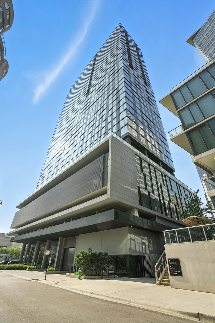 Experience Elevated Living-Luxury Residence with Exceptional Amenities with garage parking at a price you can't resist. Welcome to your sophisticated urban sanctuary, where luxury meets lifestyle. Nestled in a premier high-rise community, this impeccably designed residence offers more than just a home - it delivers an elevated living experience. This one bedroom one bathroom unit offers breathtaking city skyline views through tall, expansive windows with motorized blinds that flood the space with natural light. Inside, you'll find a thoughtfully designed open-concept layout featuring the kitchen, a dedicated laundry area, a full bathroom, and a cozy family room perfect for relaxing or entertaining. The spacious bedroom features a closet with a custom-made organizer, providing comfort and function in a sleek, modern setting.The Reed offers room to roam, relax, or reflect in thoughtfully-designed spaces. Located along the Chicago River, adjacent to the 2-acre Southbank Park, residents of The Reed can enjoy over 27,000 square feet of amenities. Step outside your door and discover an unmatched collection of amenities thoughtfully curated to enrich every aspect of your life. Spend sunny afternoons lounging by the outdoor pool with private cabanas, or gather with friends around the fire pit in the outdoor lounge, surrounded by lush lawn space designed for relaxation and connection. Host unforgettable evenings in the River Lounge and Dining Room, offering breathtaking views and stylish entertaining space. For outdoor culinary enthusiasts, enjoy the al fresco kitchen and grilling area, perfect for summer dining under the stars. Wellness is seamlessly integrated into your routine with a state-of-the-art Fitness Club, Strength Studio, and Motion Studio for private classes. Step onto the outdoor Fitness Terrace for open-air workouts, or unwind in the private massage and salon rooms, created for your comfort and convenience. Residents enjoy exclusive access to a Media Room with 86" TV and live karaoke, as well as a Sports Lounge featuring an interactive sports simulator - ideal for entertaining or relaxing after a long day. No need to worry about finding parking or the hassle of city parking-a separate deeded parking spot in the secure parking garage is included in the sale and listing price, offering peace of mind and added convenience. Additional features include: Indoor garage parking with electric car charging stations, Bike storage with wash and repair station,Dry cleaning drop-off and pick-up area, Package receiving system with cold storage for groceries, Individual storage lockers, Dedicated study rooms, perfect for working from home. With a welcoming main lobby entrance, secure access, and convenient proximity to restaurants, public transit, parks, and everything downtown Chicago has to offer. This is more than a home - it's a lifestyle defined by comfort, convenience, and community. Don't miss the opportunity to own a residence in one of the city's most amenity-rich addresses