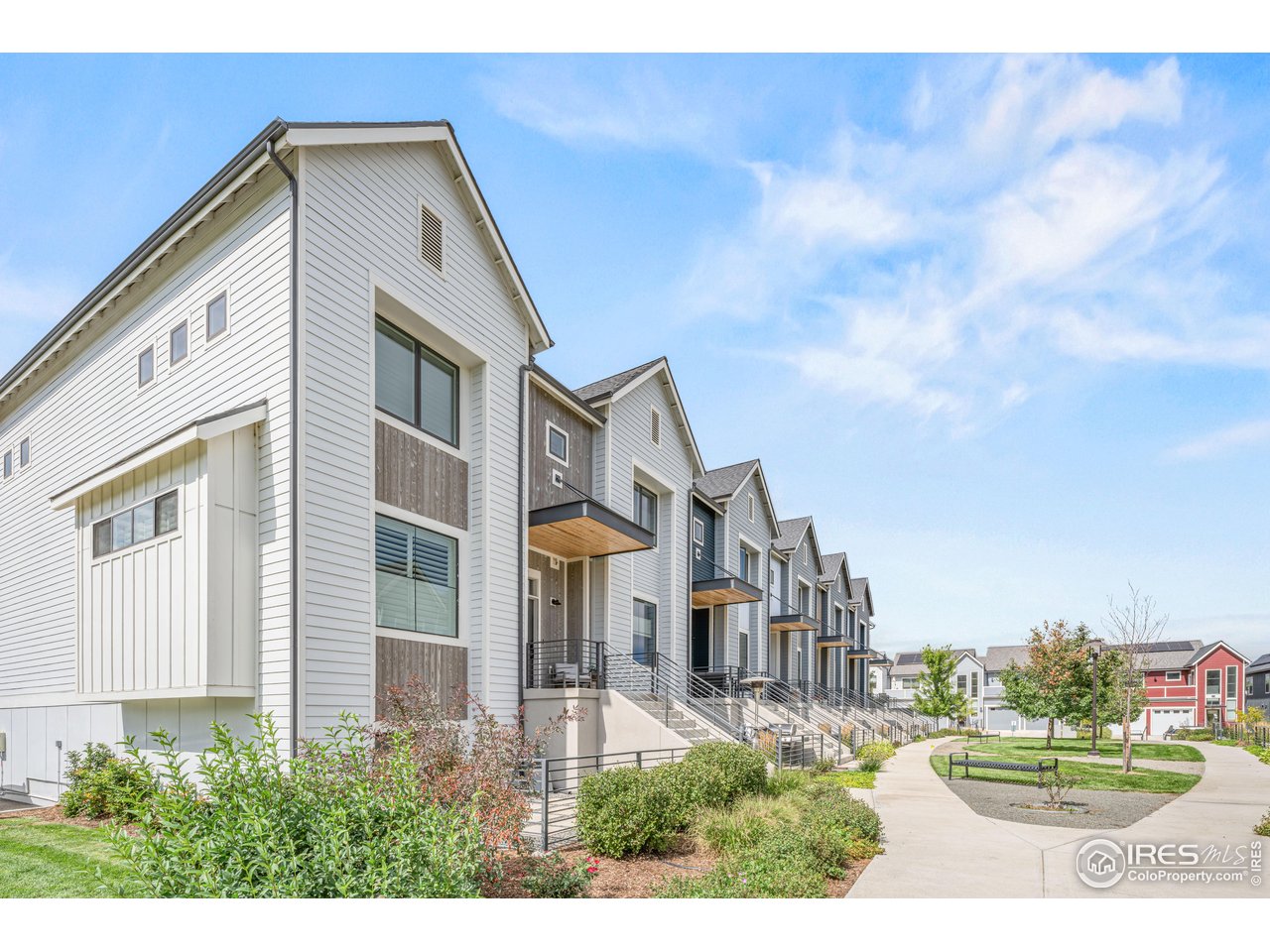 PRICED TO SELL! Well below comp values. This is an exceptional end-unit townhome that combines modern sophistication, comfort, and functionality. Just a short stroll from the charm and vibrancy of historic Old Town Louisville, this move-in ready residence has been thoughtfully designed with high-end upgrades, sustainable features and custom finishes throughout. Natural light fills the interiors from east, west, and south-facing windows and strategically placed Sola Tubes. A smart lighting system provides wireless ambiance control, while seller-owned solar panels (no lease) offer both energy efficiency and long-term savings. At the heart of the home, an open floor plan creates a warm and inviting atmosphere. A double-sided fireplace elegantly connects the living room to the dining area/kitchen, bringing both charm and functionality. The kitchen features upgraded appliances, designer lighting, quartz countertops, high-end cabinetry, and a spacious walk-in pantry. Upstairs, the expansive primary suite is enhanced by a spa-inspired bathroom with premium finishes and a custom-designed walk-in closet. A spacious secondary ensuite bedroom and a laundry room complete the upper level. The lower level offers remarkable flexibility with a room that can serve as a family room, den/office or as an additional guest room. A fourth bathroom and attached two-car garage is on this level as well. This home's "lock and leave" convenience is enhanced by community amenities, including beautiful landscaping, a picturesque red barn picnic area, a community garden, and direct access to Louisville Community Park and trails. The HOA covers yard care and snow removal, ensuring easy living. Just a short stroll to Louisville's charming shops and restaurants, as well as quick access to Boulder, Denver, DIA, and the mountains, this residence presents a rare opportunity to enjoy refined, low-maintenance living in a premier location.