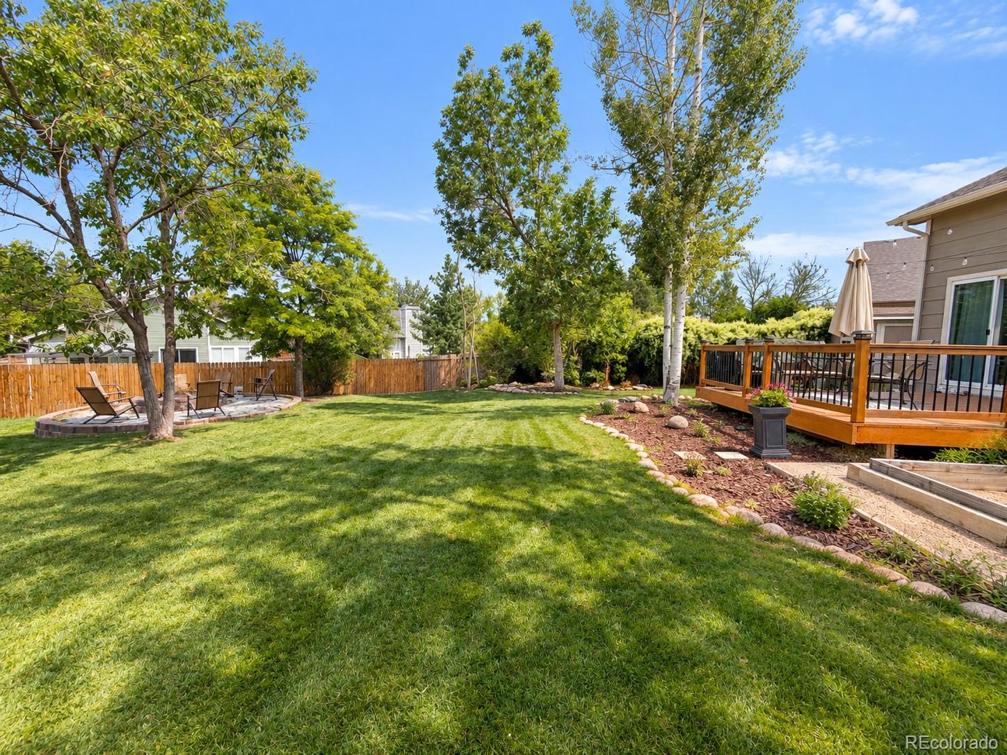 One of best and biggest backyards you will find at this price in Castle Rock! Huge lot, on a cul-de-sac, fully fenced, mature trees, privacy, garden area, a main floor primary suite, finished basement, this house is a true gem! The layout of this home is a winner. The living room has tall, vaulted ceilings and feels welcoming and open. The main floor primary bedroom suite has a large walk-in closet, an en-suite bath, and walk-out to the back deck. Upstairs has two bedrooms, a full bath, and a walkway between them that looks down to the main level. The kitchen has granite counters and updated stainless steel appliances. Downstairs you'll find another big family room, a crawl space area for storage, and a nook that is currently used as an office. The HOA has a pool, and founders park is just a short walk away. Come check this one out in person and see the home and yard for yourself!